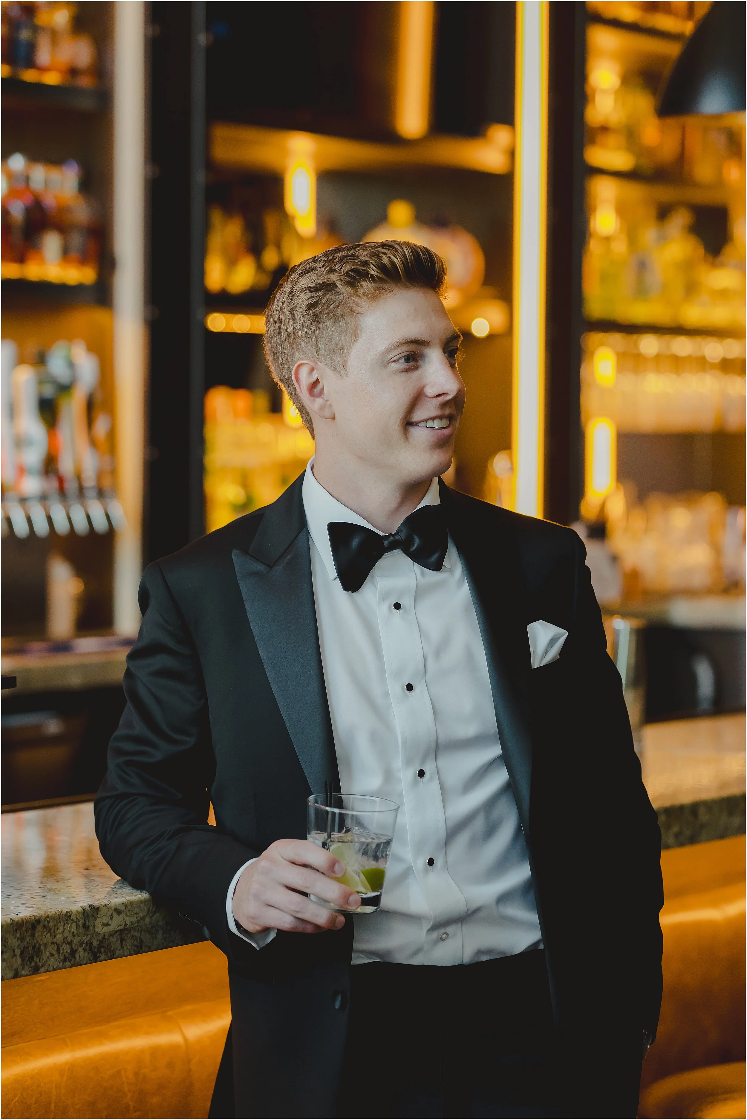 groom-in-tux-leaning-bar-drink-in-hand.JPG