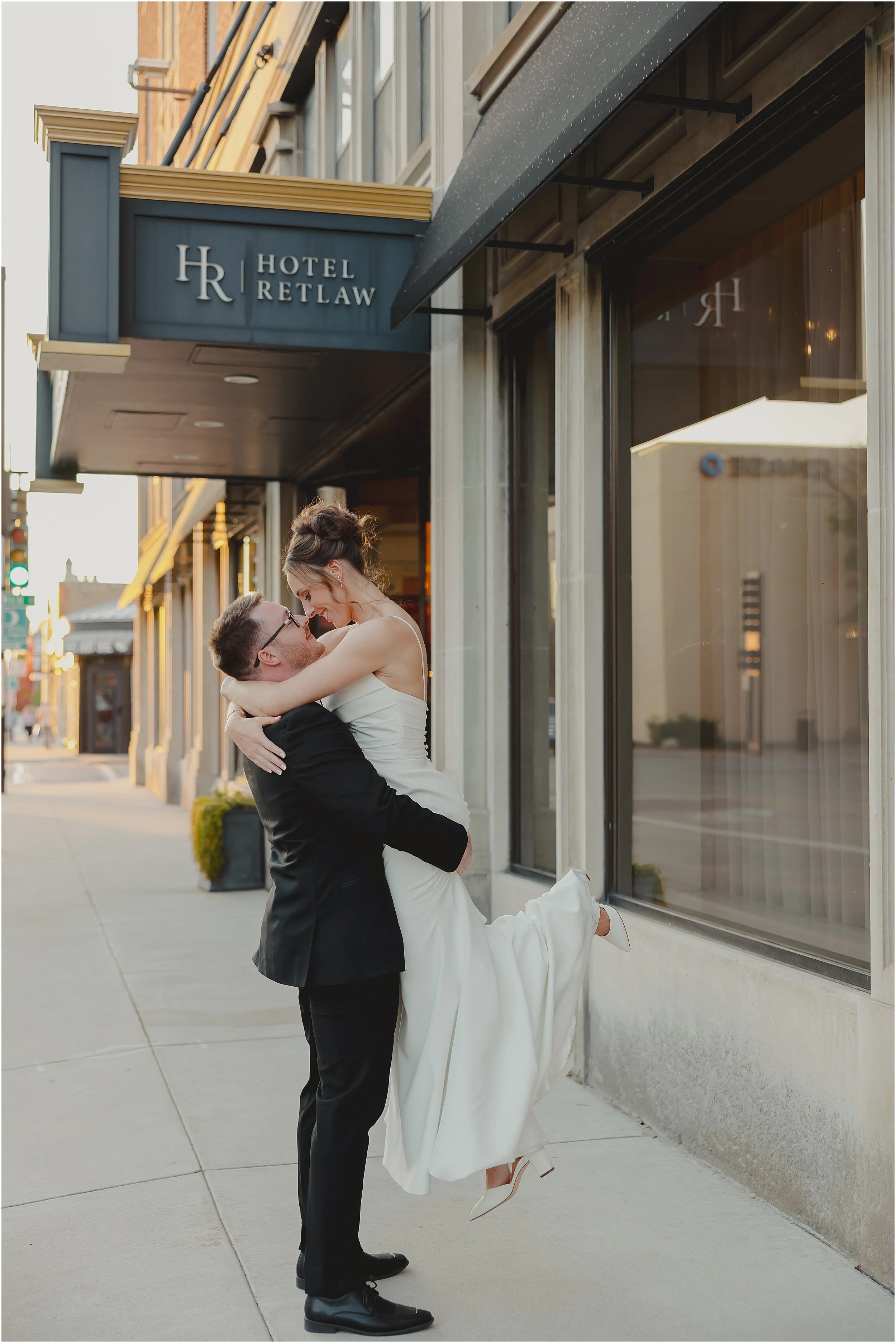 groom-lifting-bride-hotel-retlaw.JPG