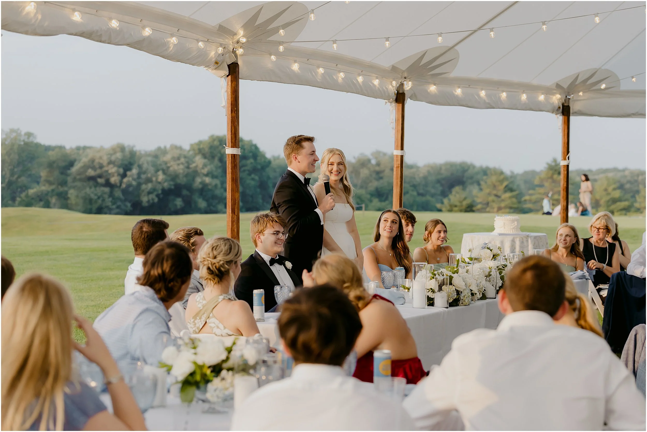 groom-giving-toast-open-air-tent-country-club-canopies-events.JPG