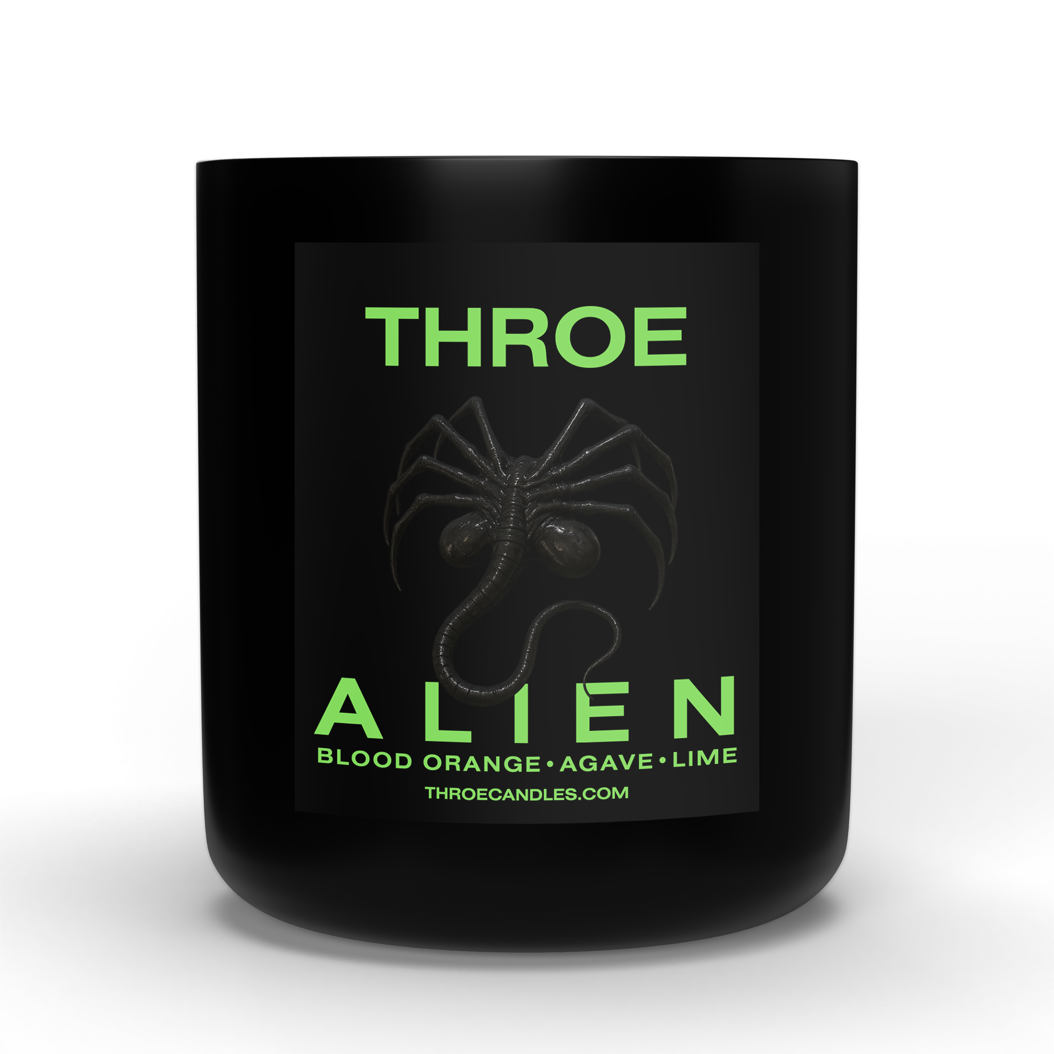 Black candle container with green text that reads 'Alien Blood Orange, Blood Orange, Agave, Lime,' with a spider graphic and the website 'throecandles.com' at the bottom.