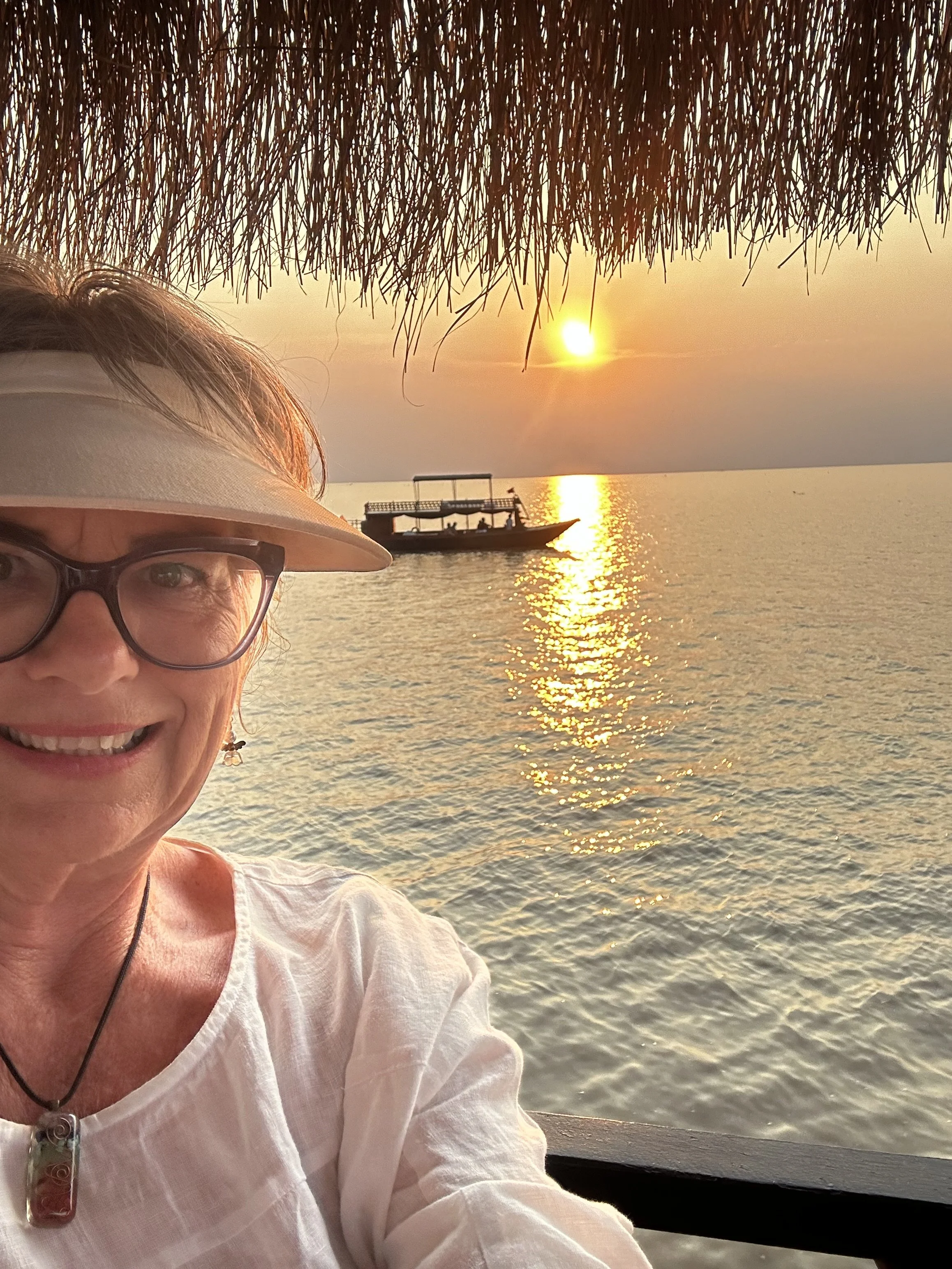 Cindy on boat at sunset.jpg