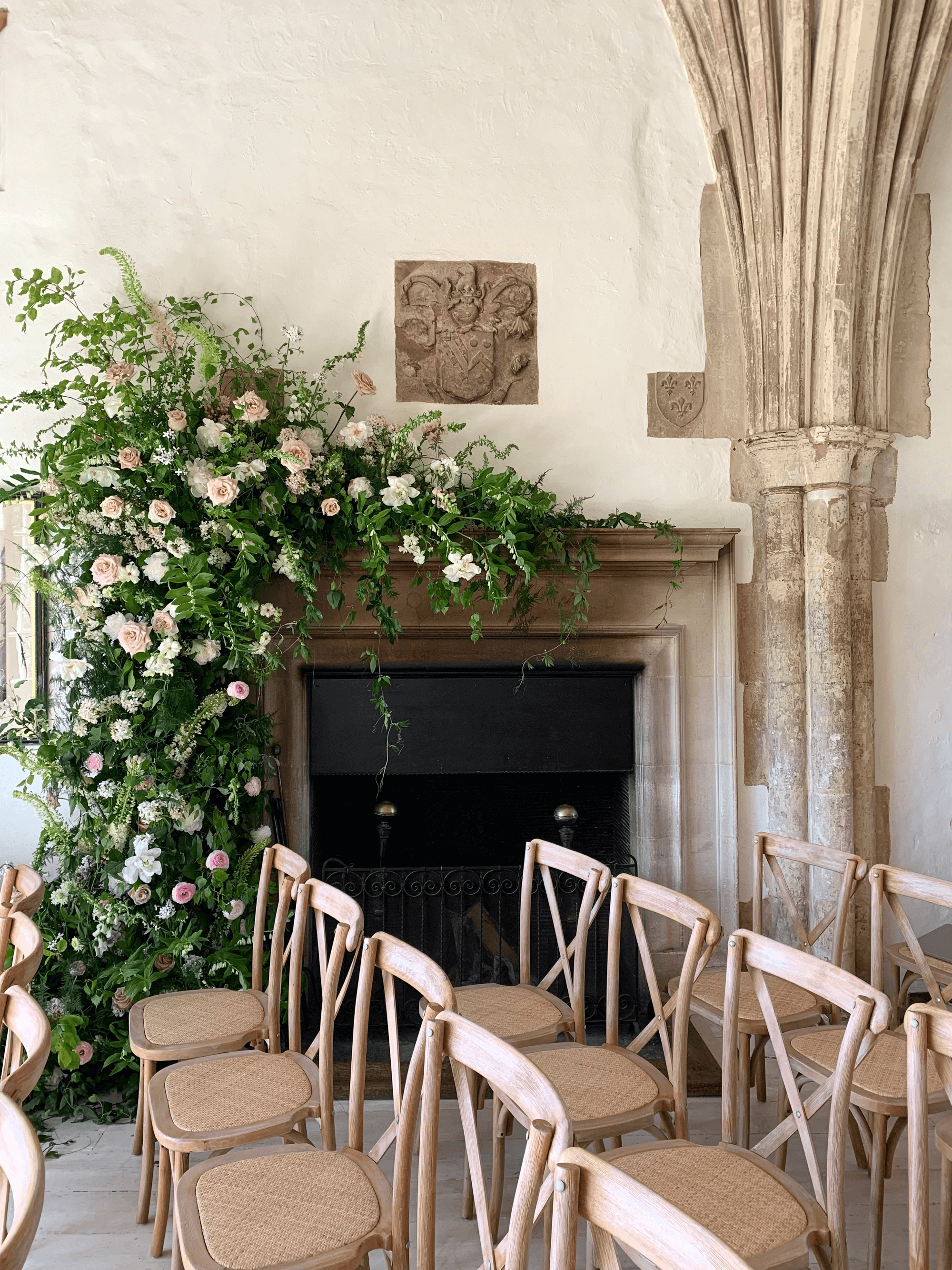 wedding ceremony chairs placed in the great hall at suffolk wedding venue butley priory