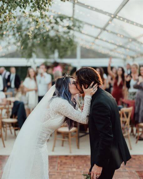 kissing-bride-groom-countryside-wedding-venue-suffolk.jpg