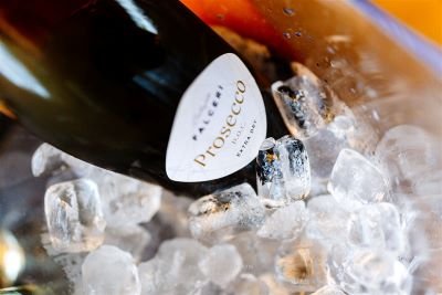 prosecco sitting in ice at suffolk wedding venue butley priory