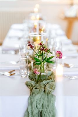wedding table with sage green table runner