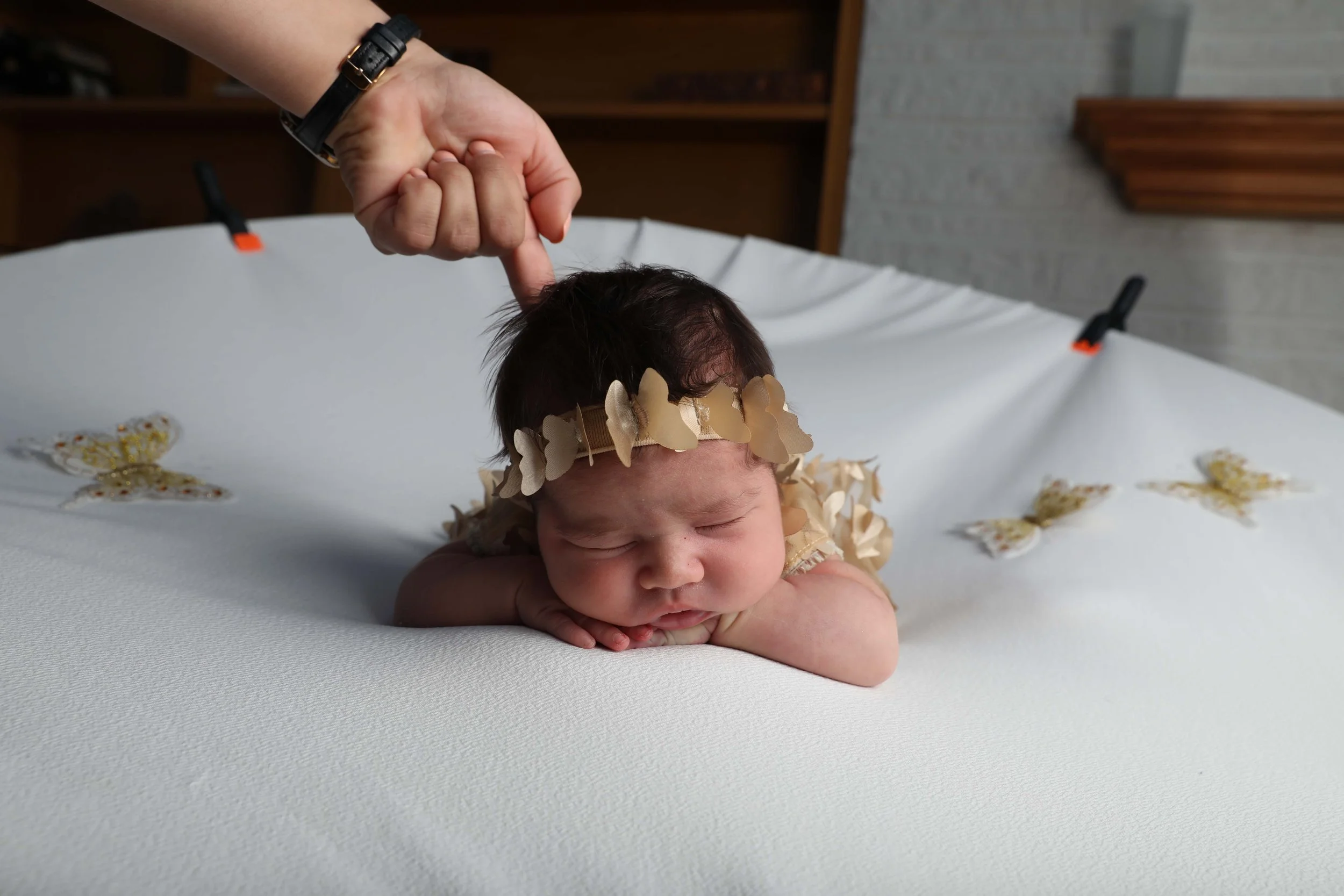 Newborn photo with head support for safety