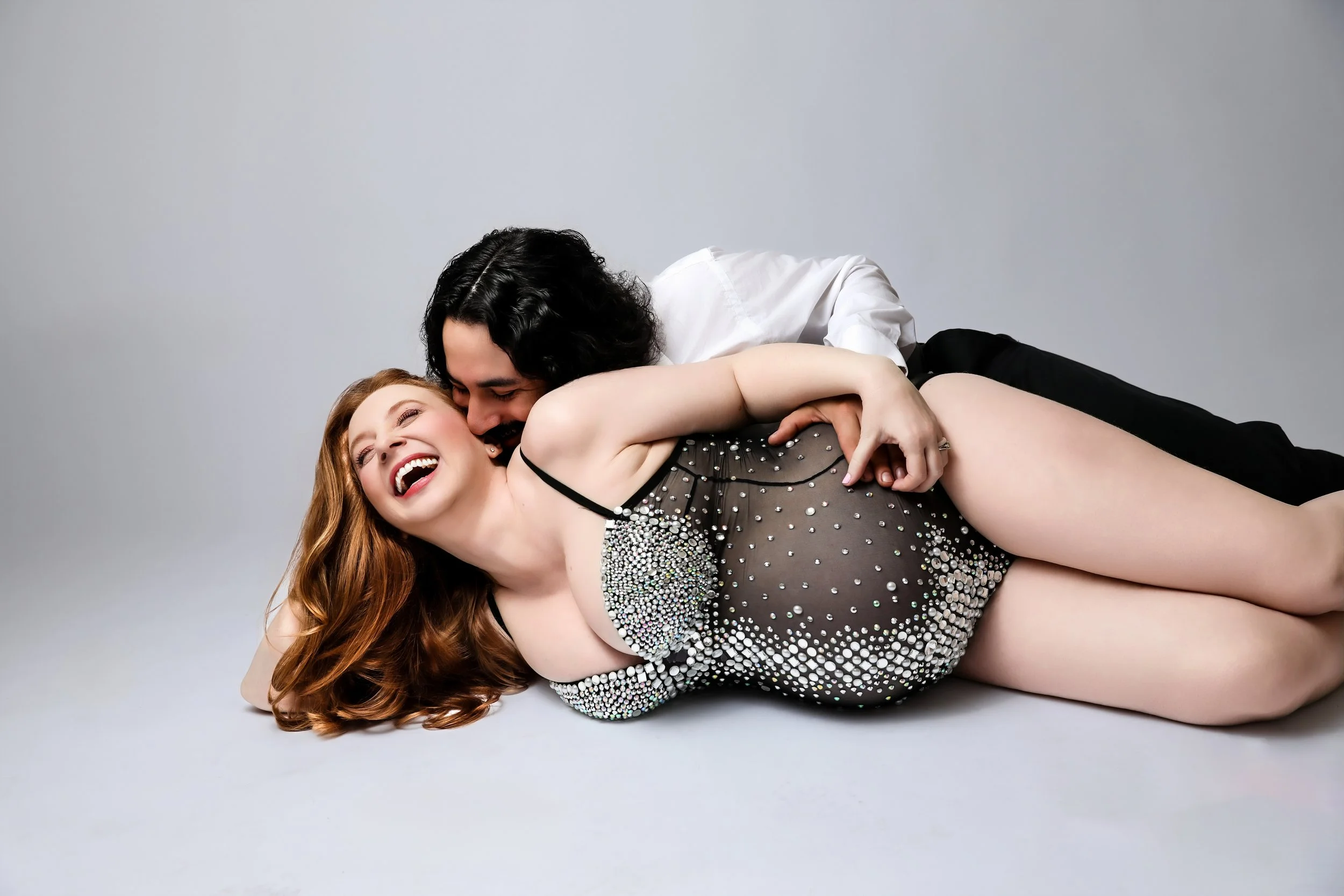 Pregnant woman with partner in Palm desert maternity photographer studio