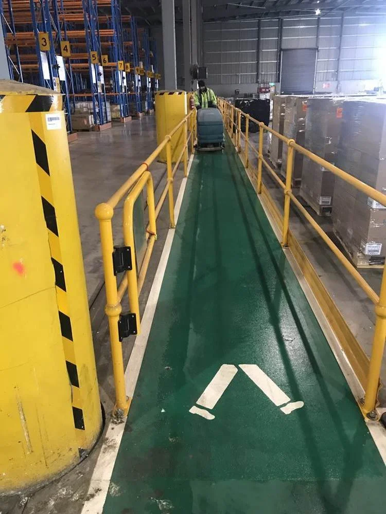 WAREHOUSE FLOOR CLEANING STARTS WITH SWEEPING THE FLOOR. Walkway focus ...