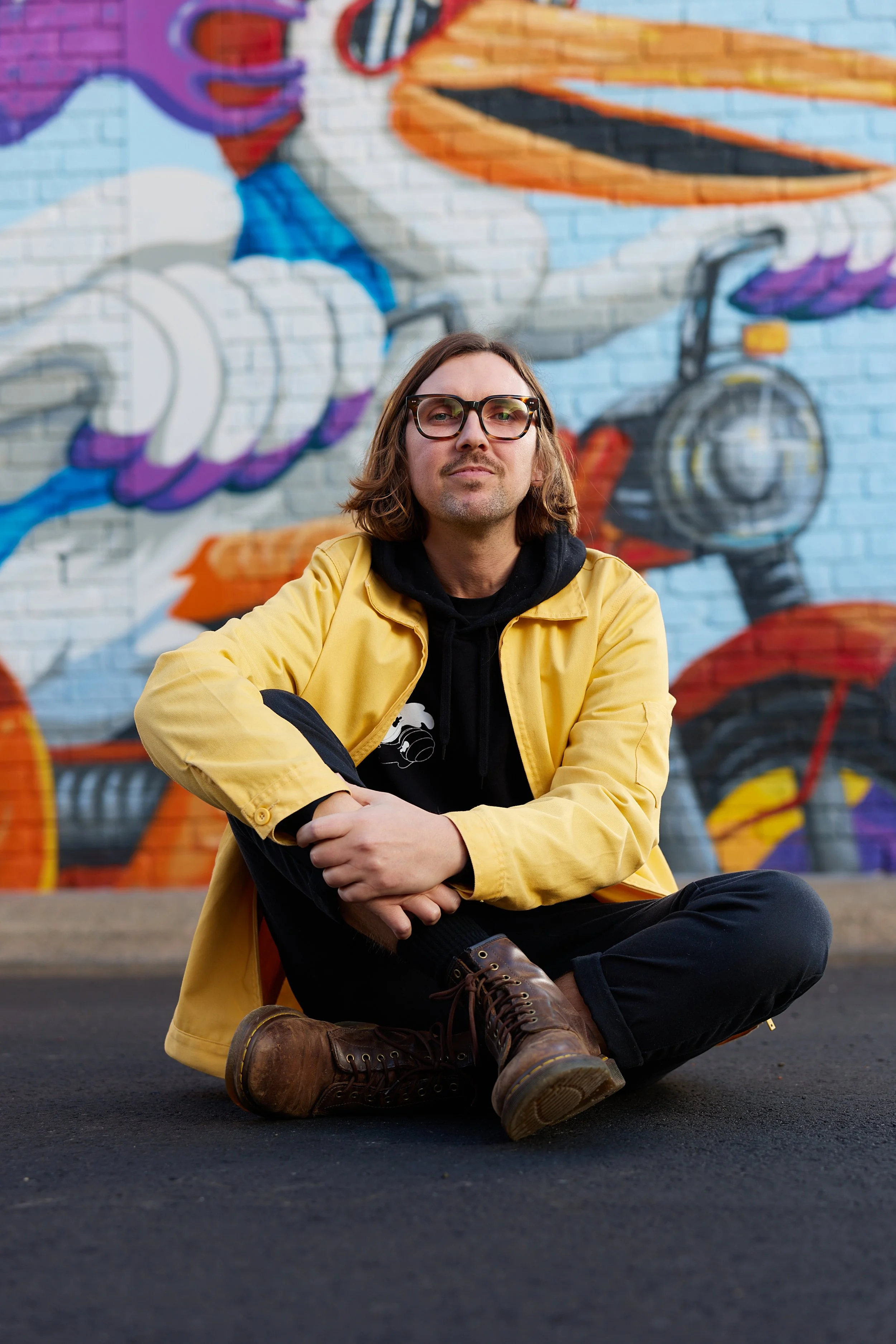 Brad in front of his Pelican Mural in Philips Lane, Port Macquarie