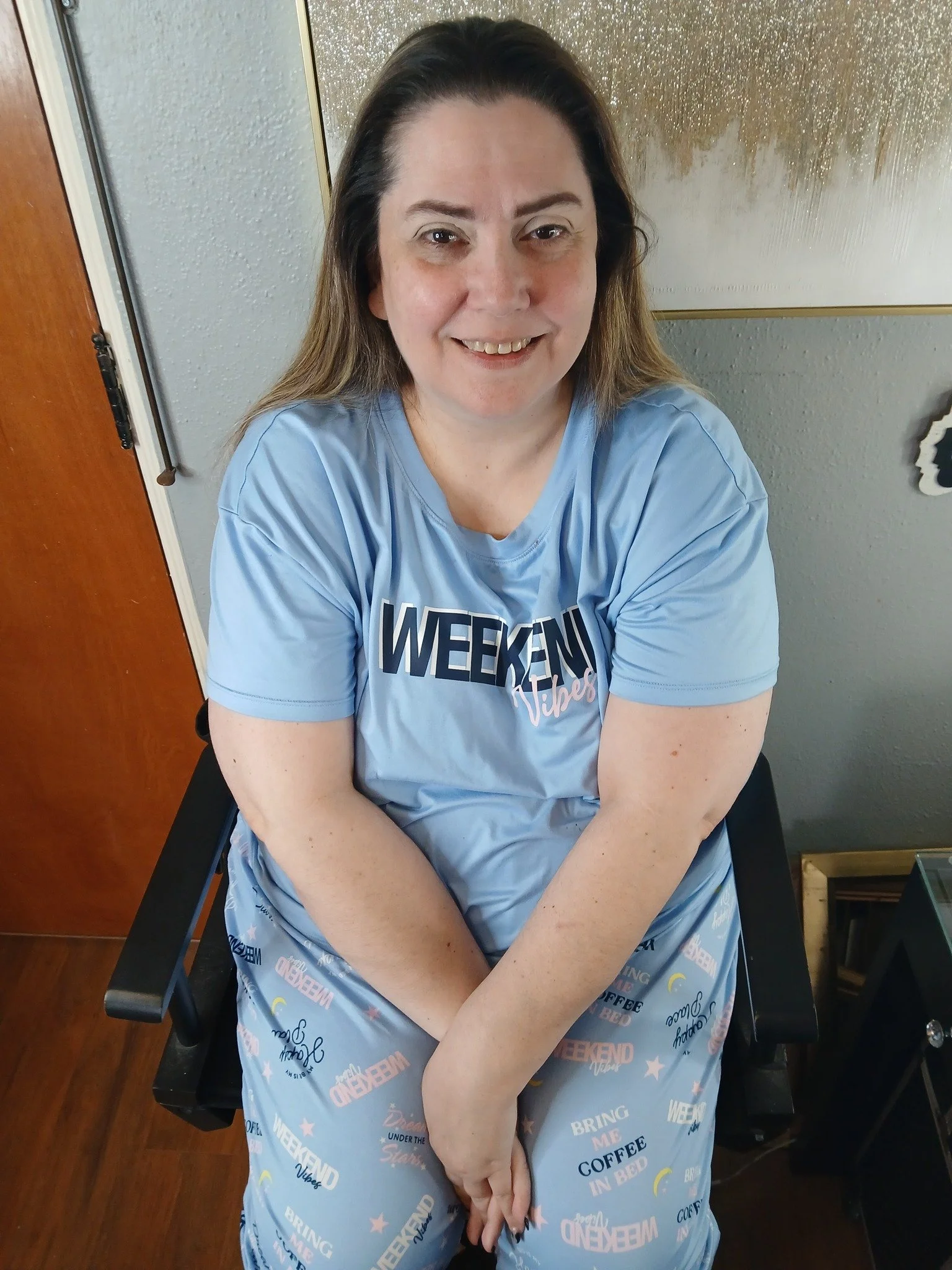 Before photo of boudoir client wearing casual clothing and smiling softly before her session at a Springfield Missouri boudoir studio