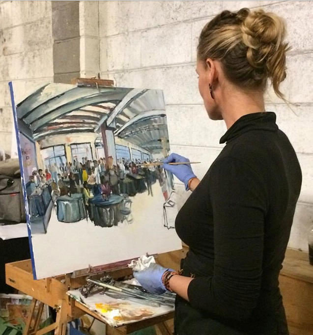 Woman in black, Jamie Peterson, painting a scene