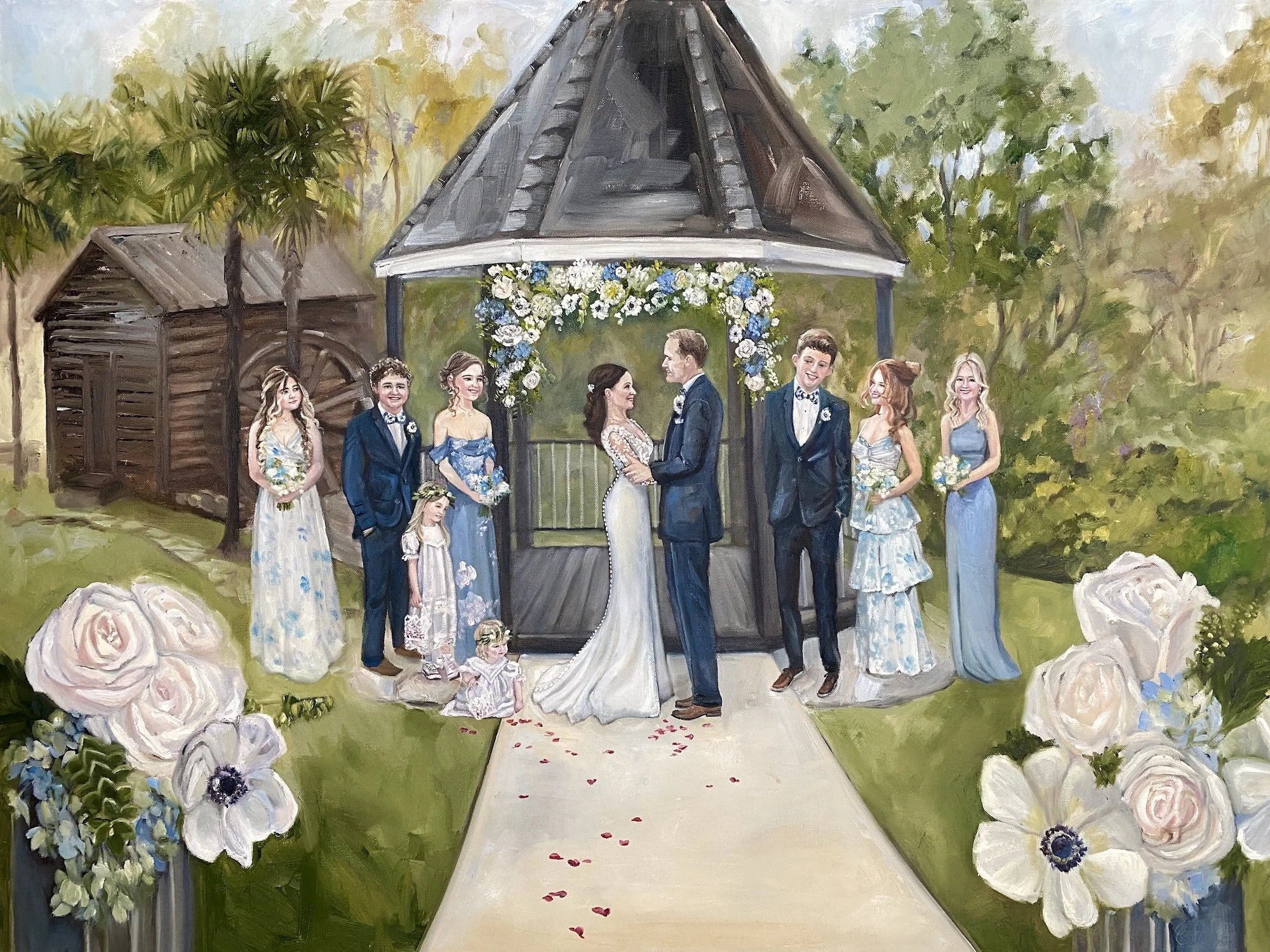 A bride and groom getting married with their kids and grandkids as their wedding party and flowers in the foreground at Corley Mill House in South Carolina
