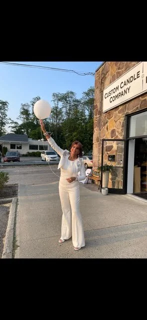 Marcie with a Balloon outside of her store.jpg