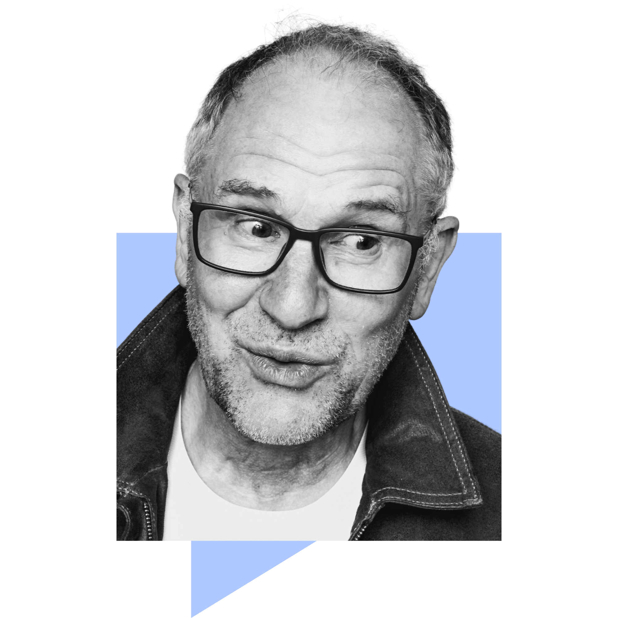 A black and white photograph of an older adult man wearing glasses, looking directly at the camera with a slight smile, and wearing a dark jacket.