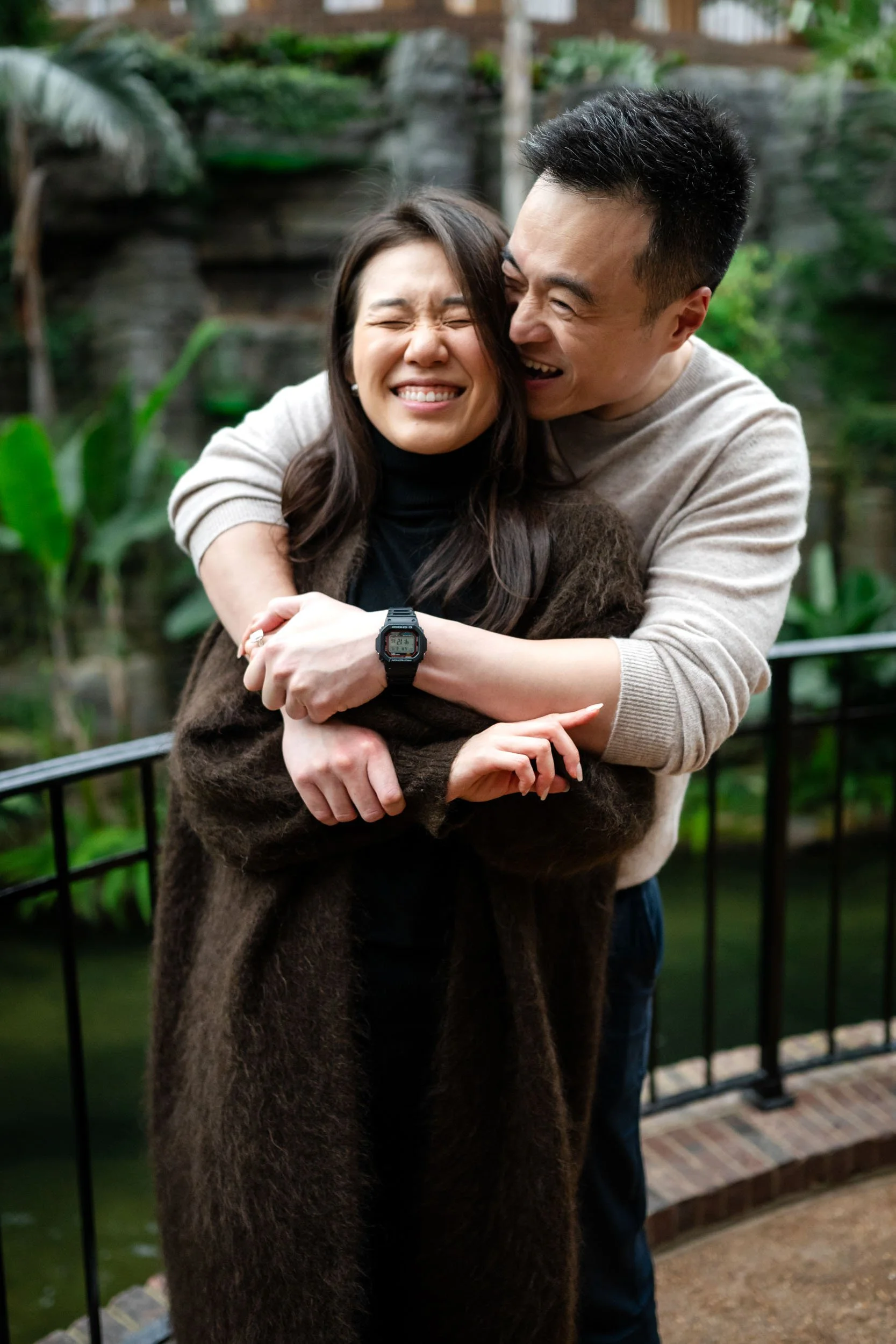 couple laughing Holding hands engagement photography Nashville soft portrait engagement photo couple nashville TN Gaylord Opryland Resort & Convention Center proposal photos