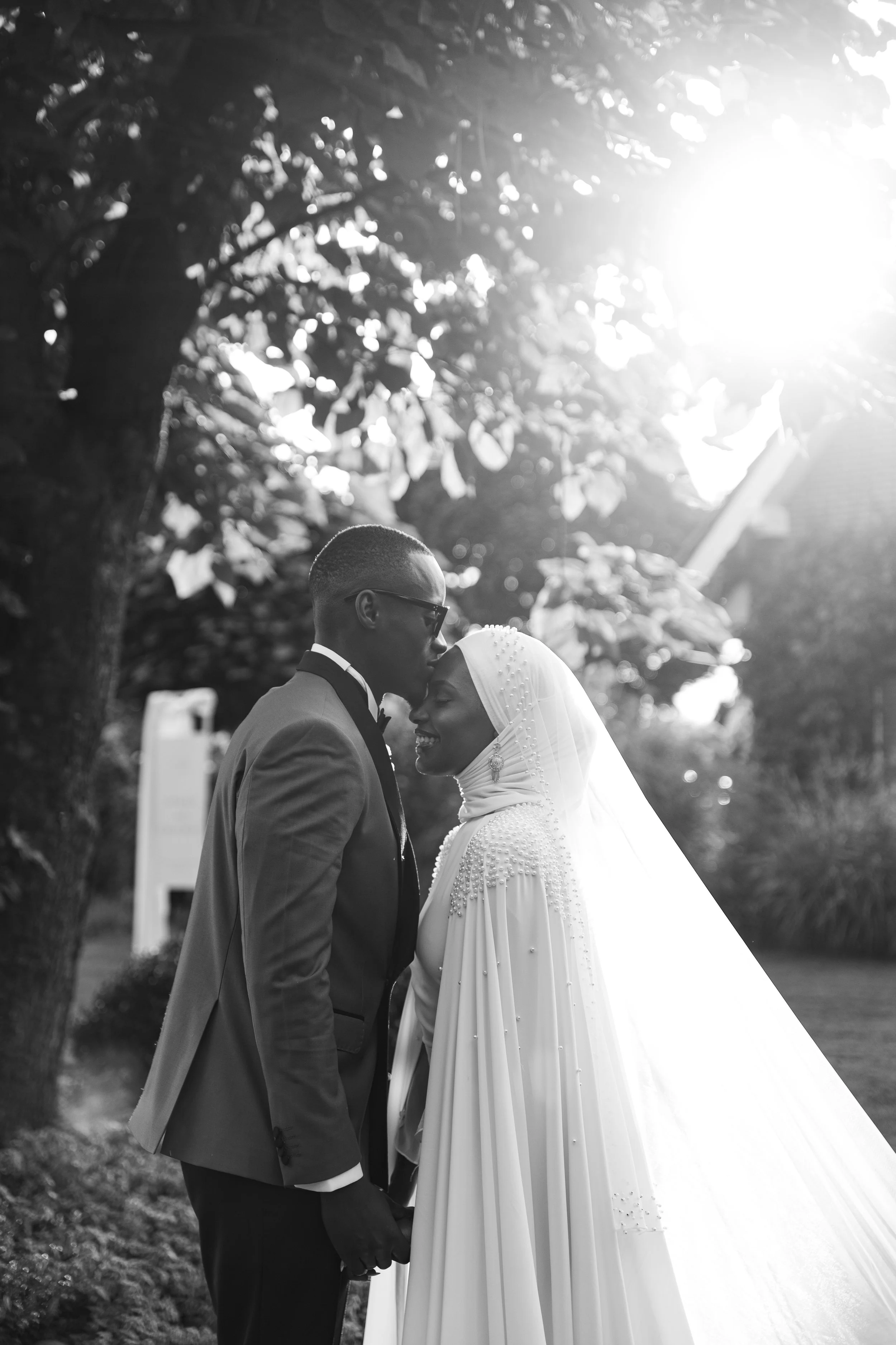 Bride and groom sharing a natural moment outdoors, captured by Hannover wedding photographer Yassyn Nizeyimana.