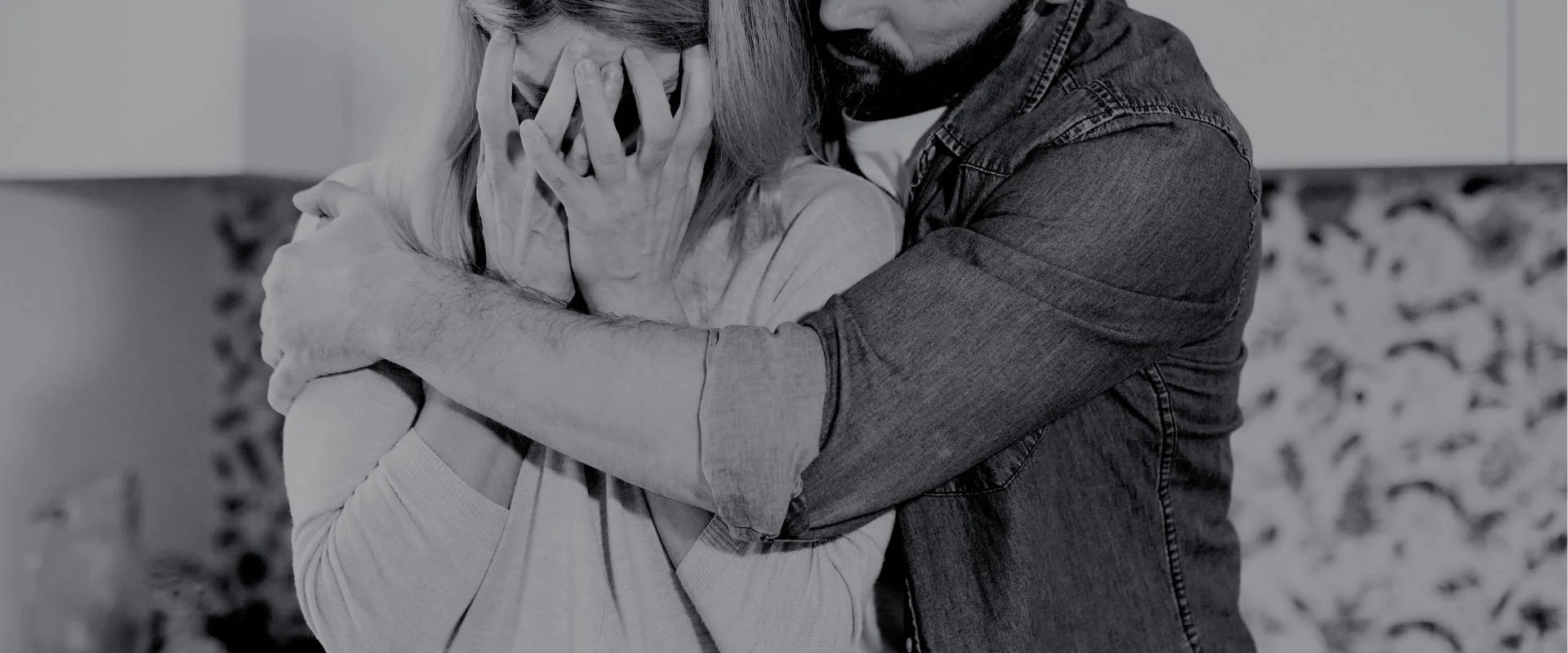 husband comforting wife after child loss.