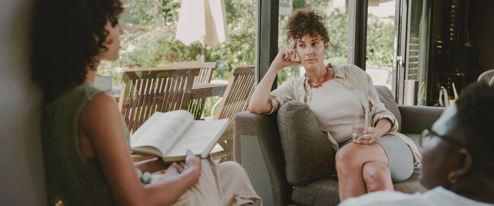 2 women talking about child loss and sharing their faith.