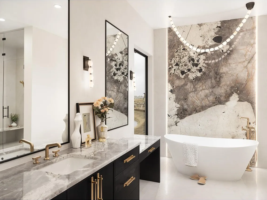 The backlit Patagonia quartzite slab and Collier Alabaster 84 chandelier.