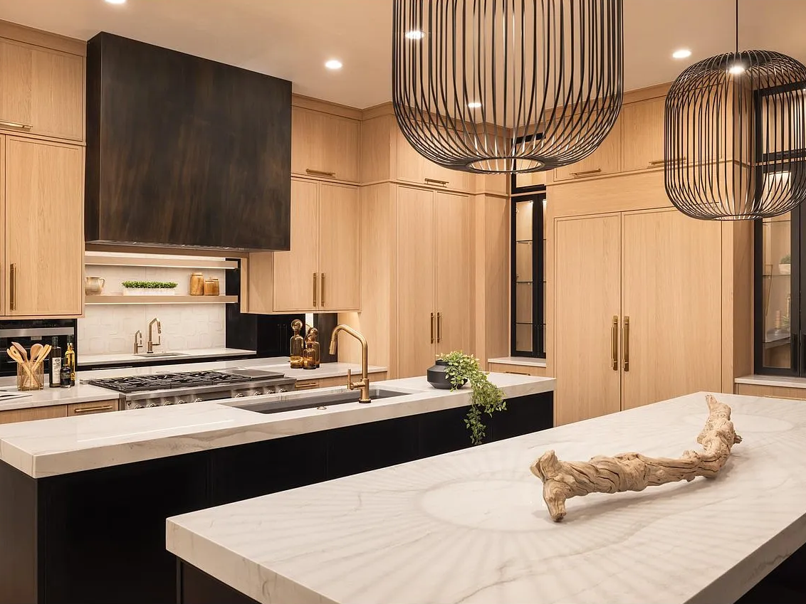 Kai 2 pendants over Tahiti counters, with the antique brass hood set into white oak.