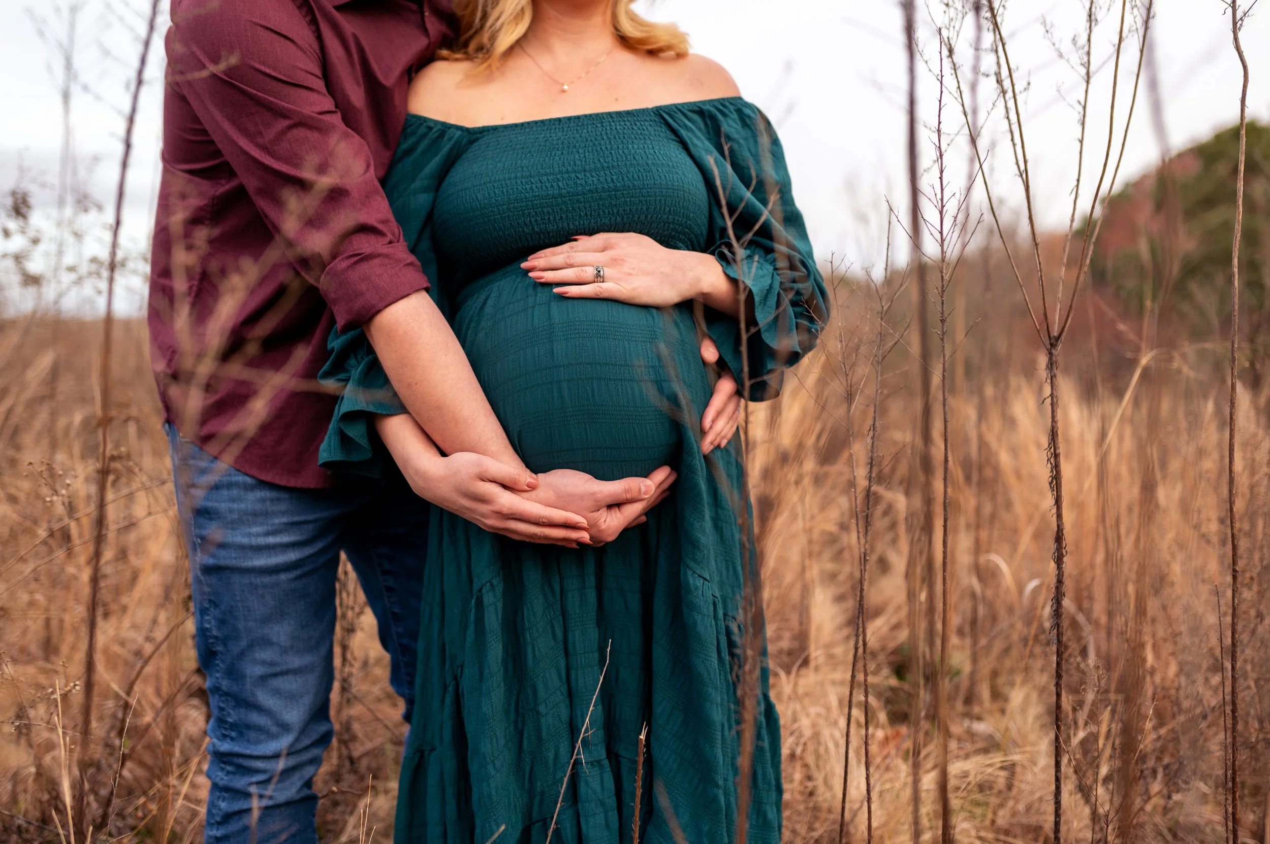 Maternity photography by Briana Woods: Couple embraces the baby-bump.
