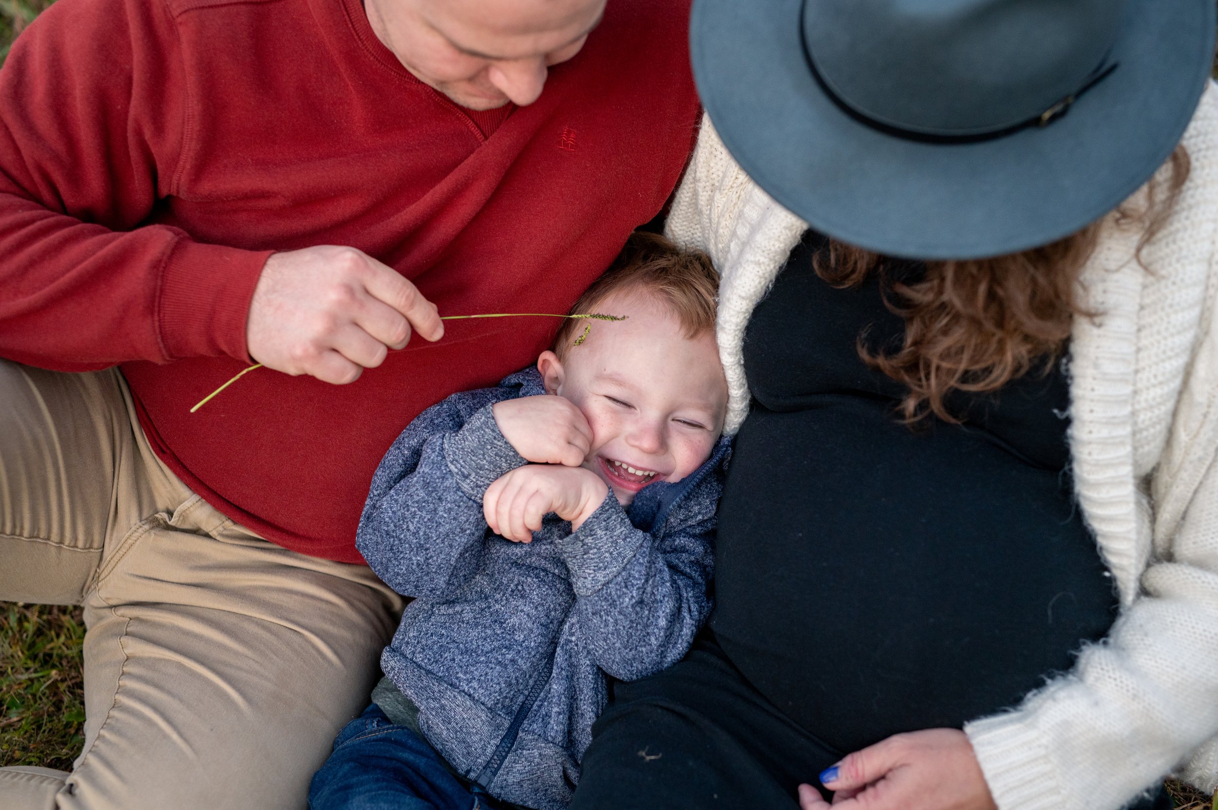Maternity photography by Briana Woods: Fall family session with young son.