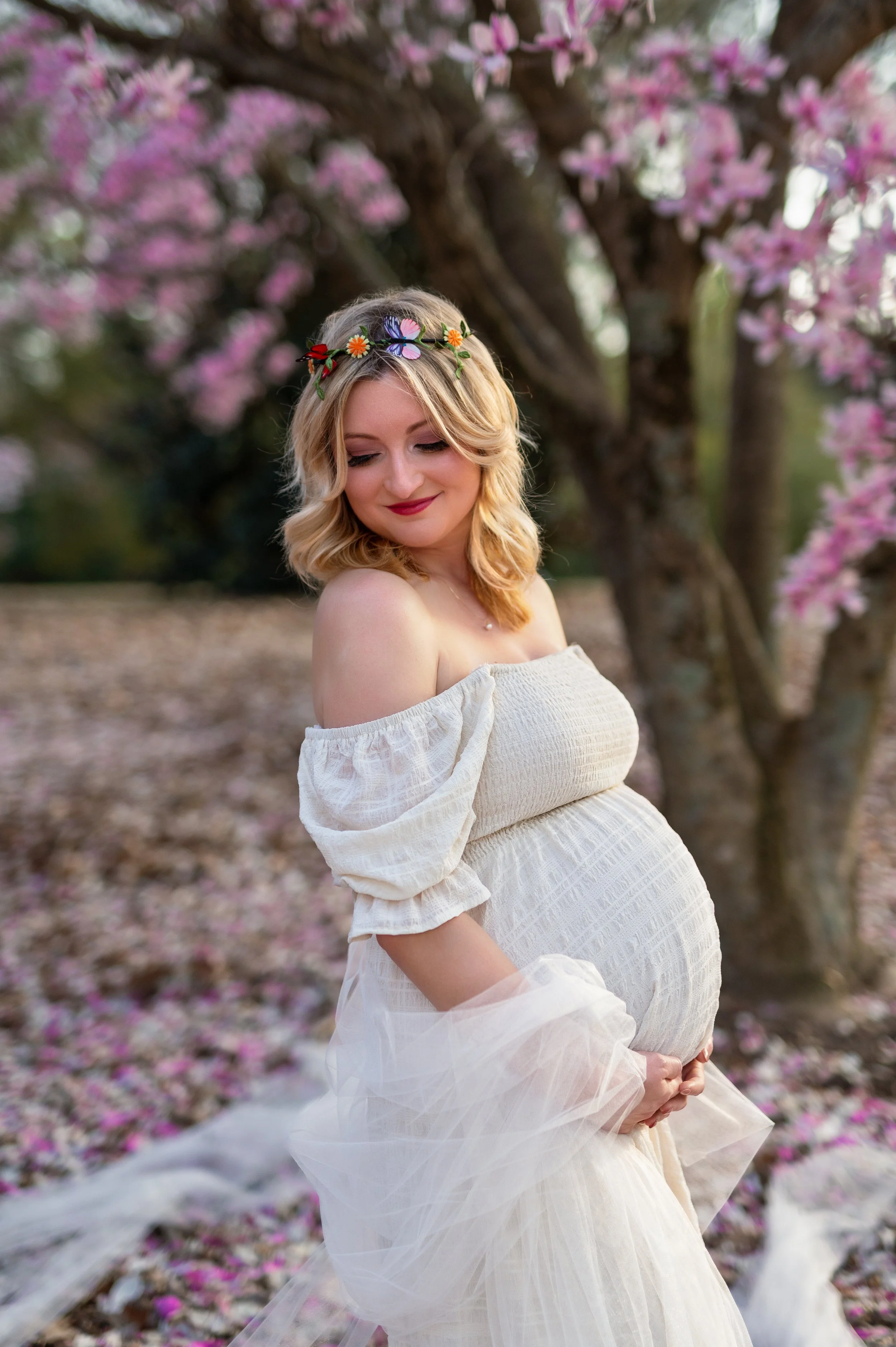 Maternity photography by Briana Woods: Boho magical-vibes under pink flowers.