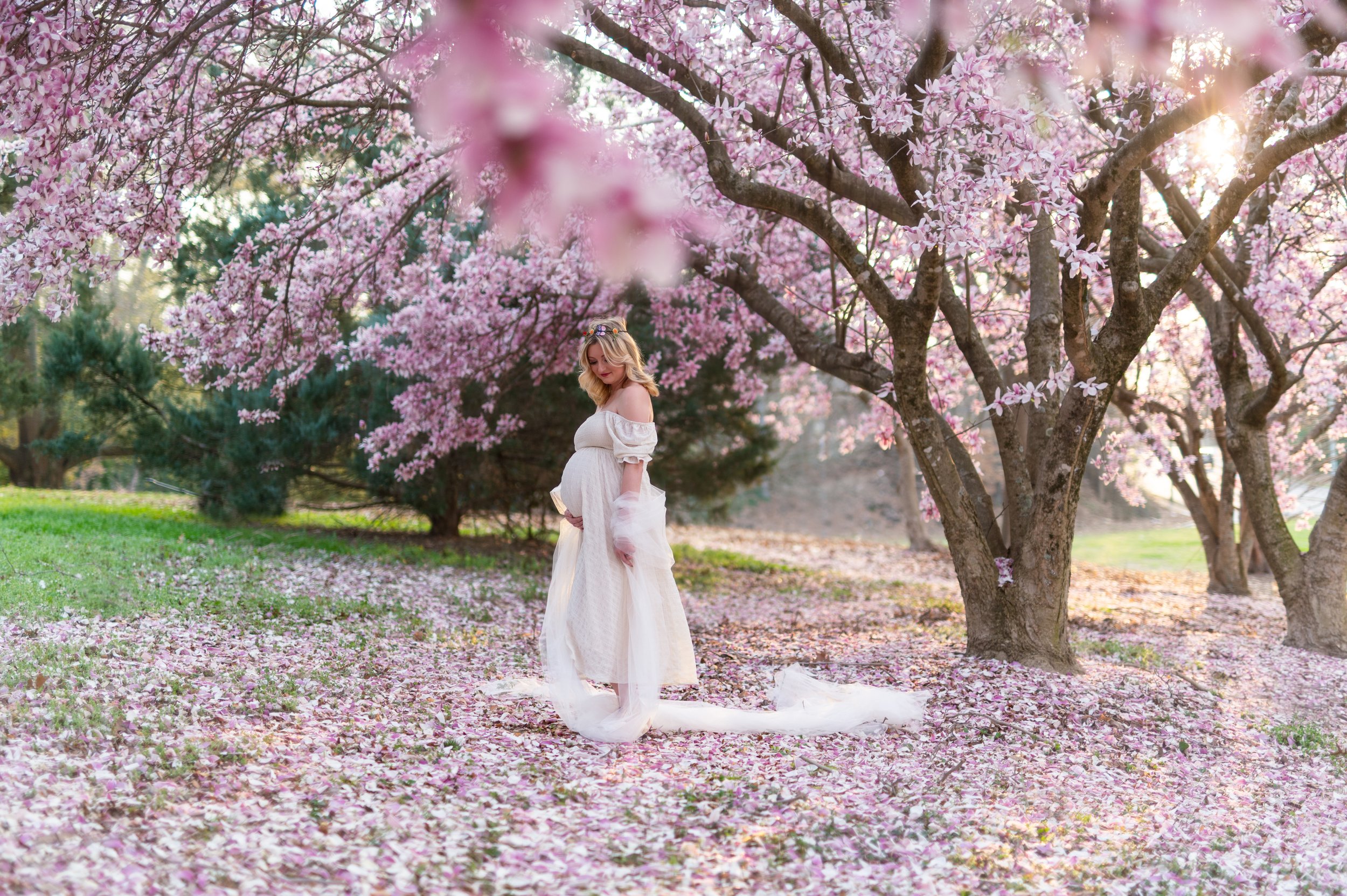 Maternity photography by Briana Woods: Boho magical-vibes under pink flowers.