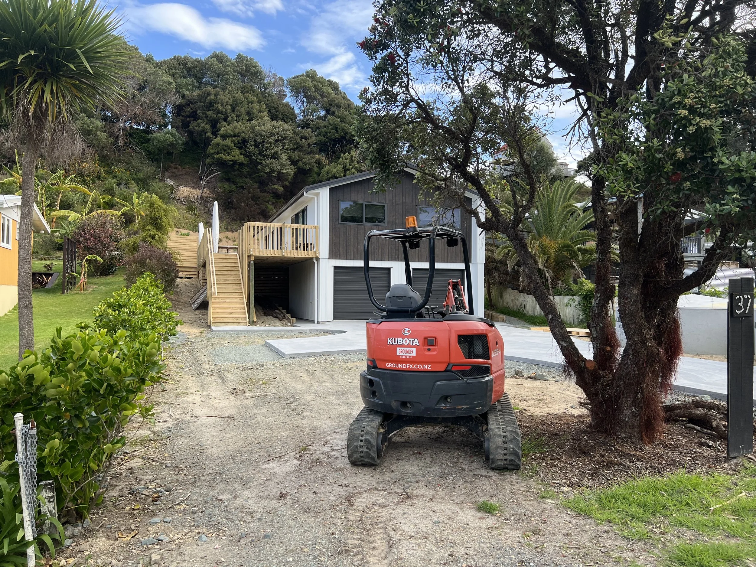Contractor preparing lawn base for seeding Northland