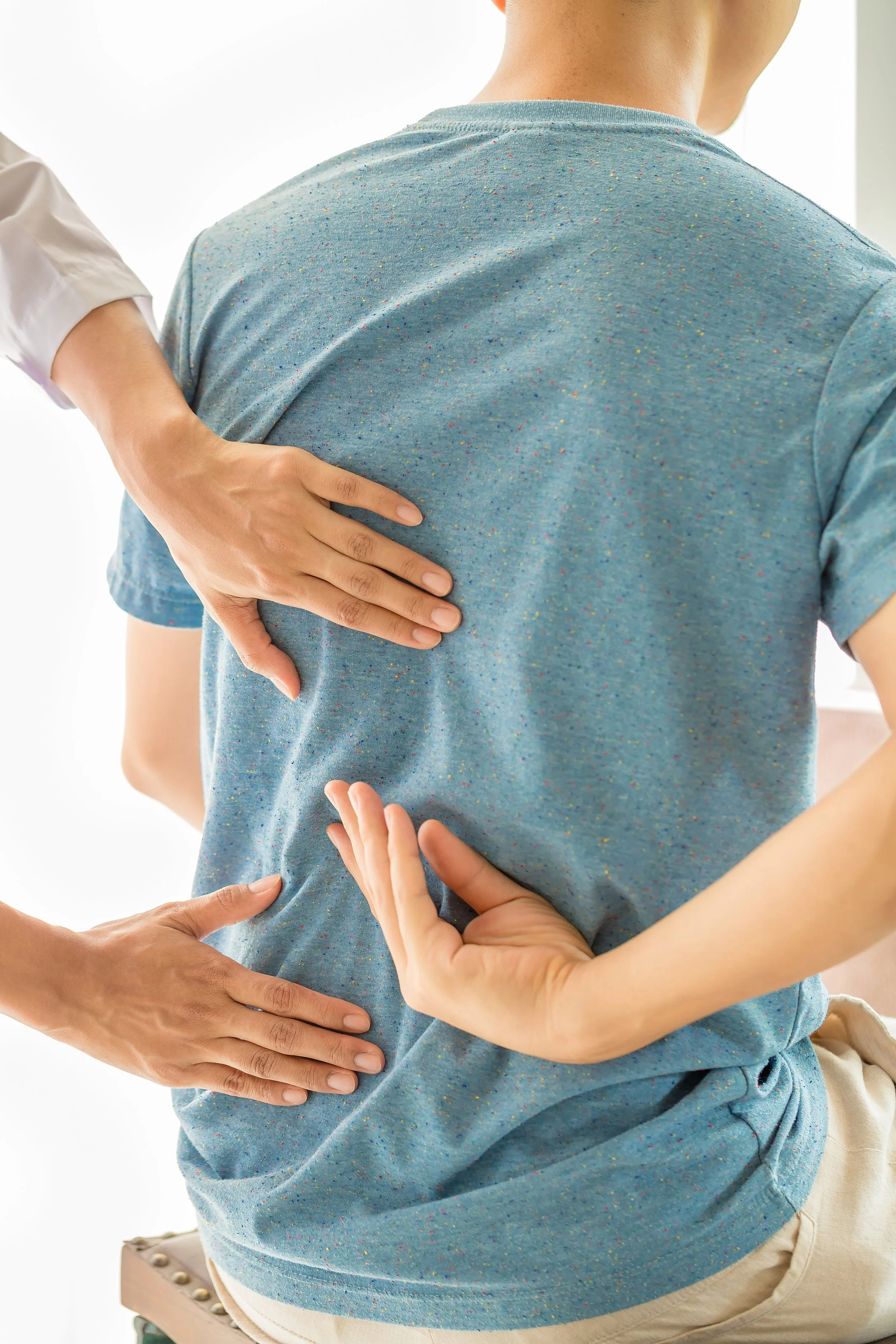 Adult chiropractic adjustment for back pain relief in Columbus GA clinic.