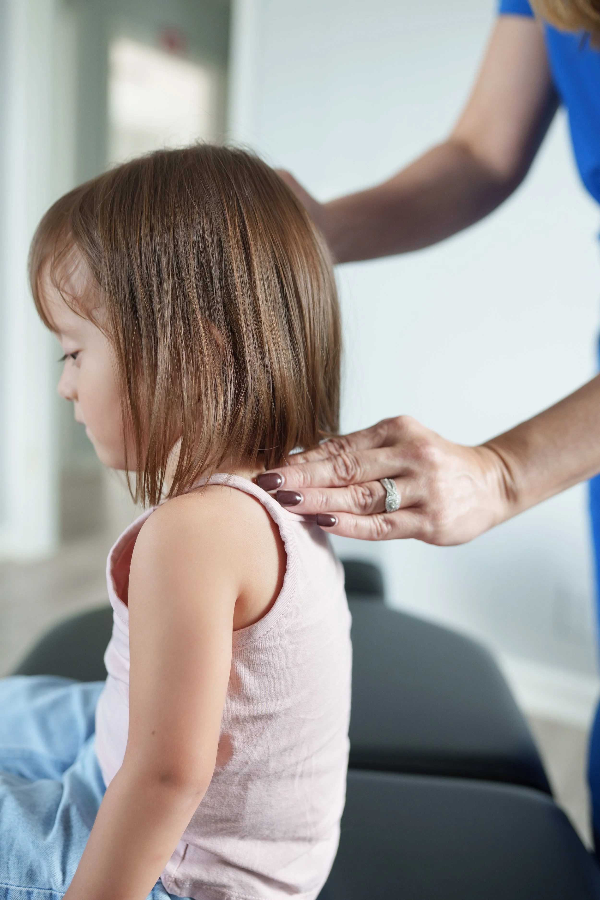 Child receiving gentle chiropractic care for posture and comfort in Columbus GA