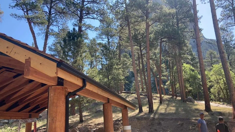 Gutters installed on a wooden building near Devils Tower, Wyoming by Vazquez Garage Doors and Gutters