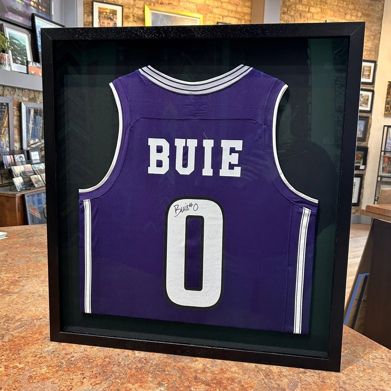 Purple Buie Nortnwestern Jersey shadowbox framed in black