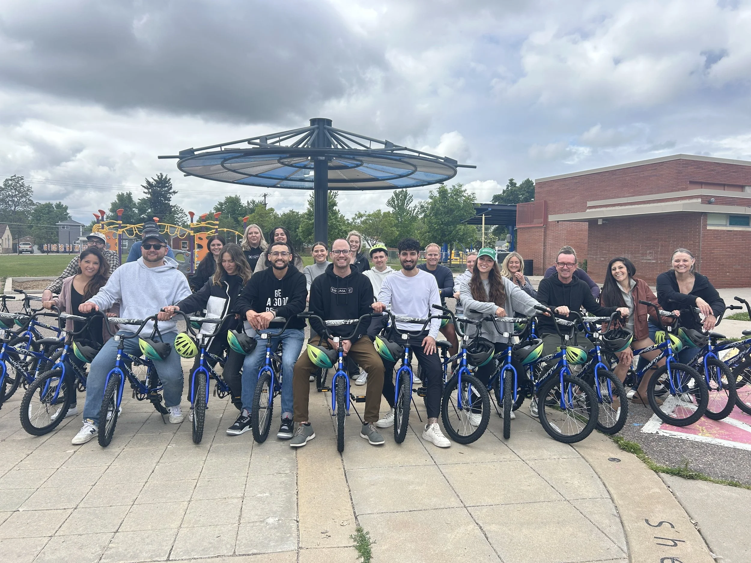 A corporate team and the bikes they build during a team building event with Wish for Wheels.