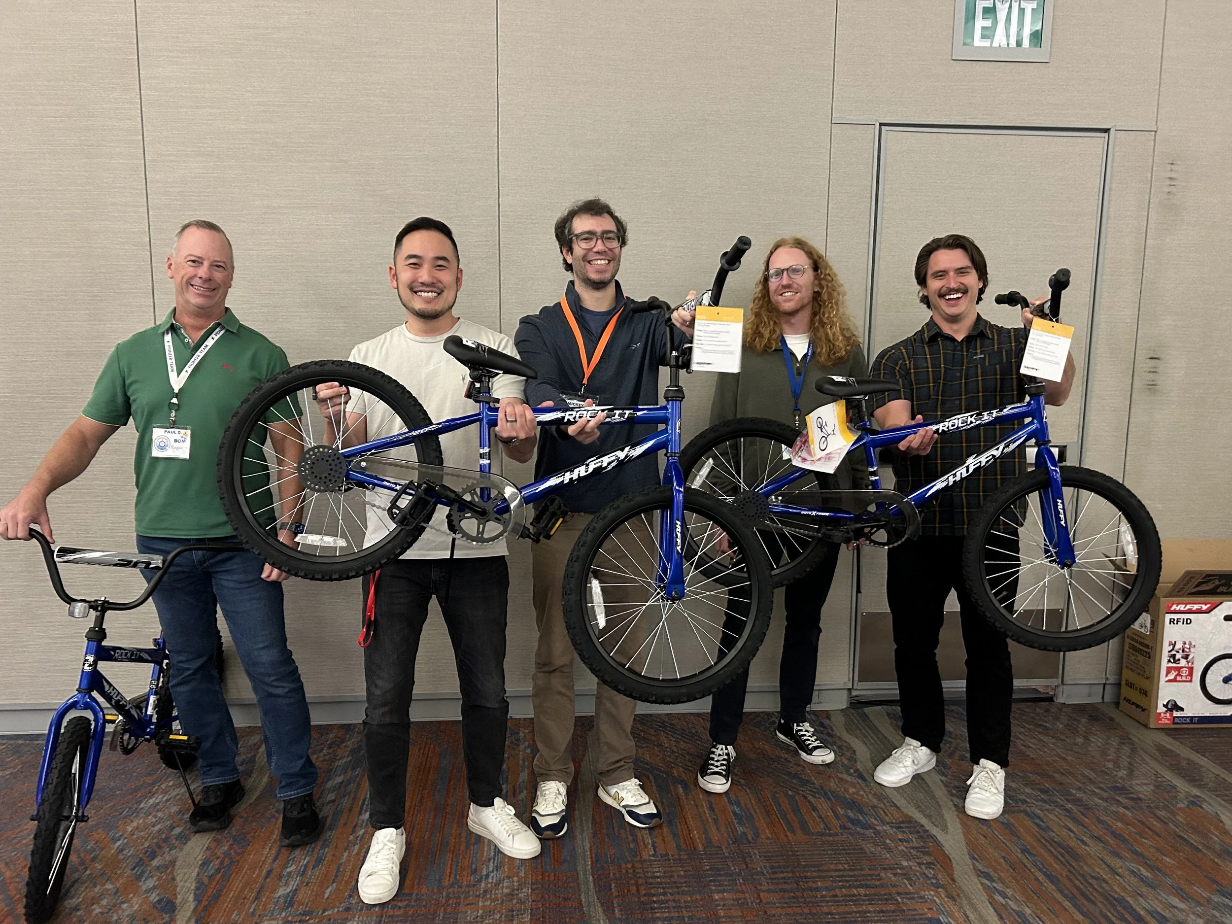Team members celebrating after completing bicycles during a Bike Build & Give event