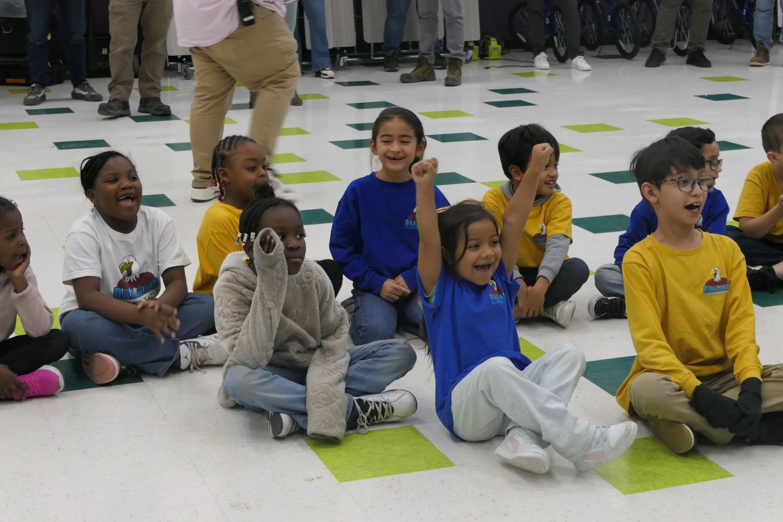 Children celebrating at a community Bike Build & Give event