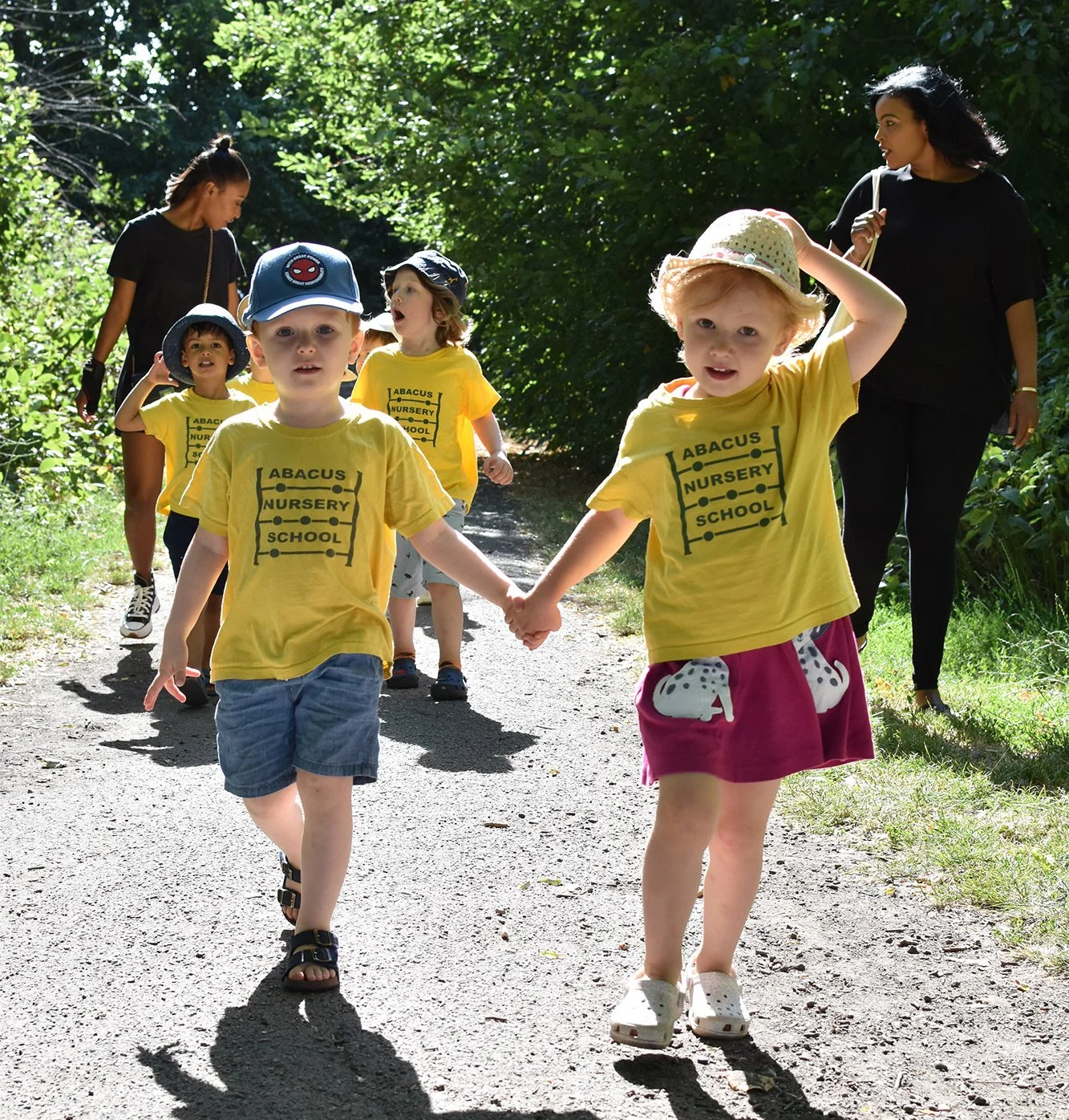 Children taking part in outdoor and forest school learning activities that encourage curiosity and confidence.