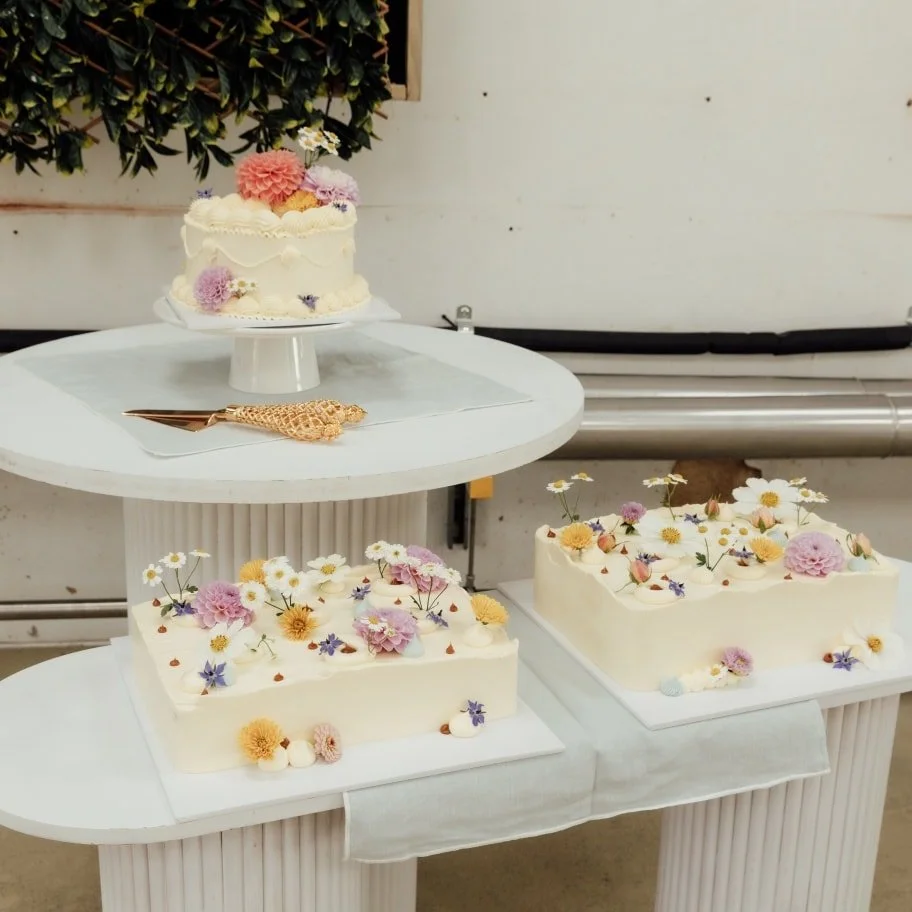 Delicious buttercream and a perfect scatter of blooms, proof you don&rsquo;t need &ldquo;more&rdquo; to make a moment memorable.

We can style your cake table with plinths, stands, knife and plates so it looks this effortless.

@nichollsandco.nz Plan