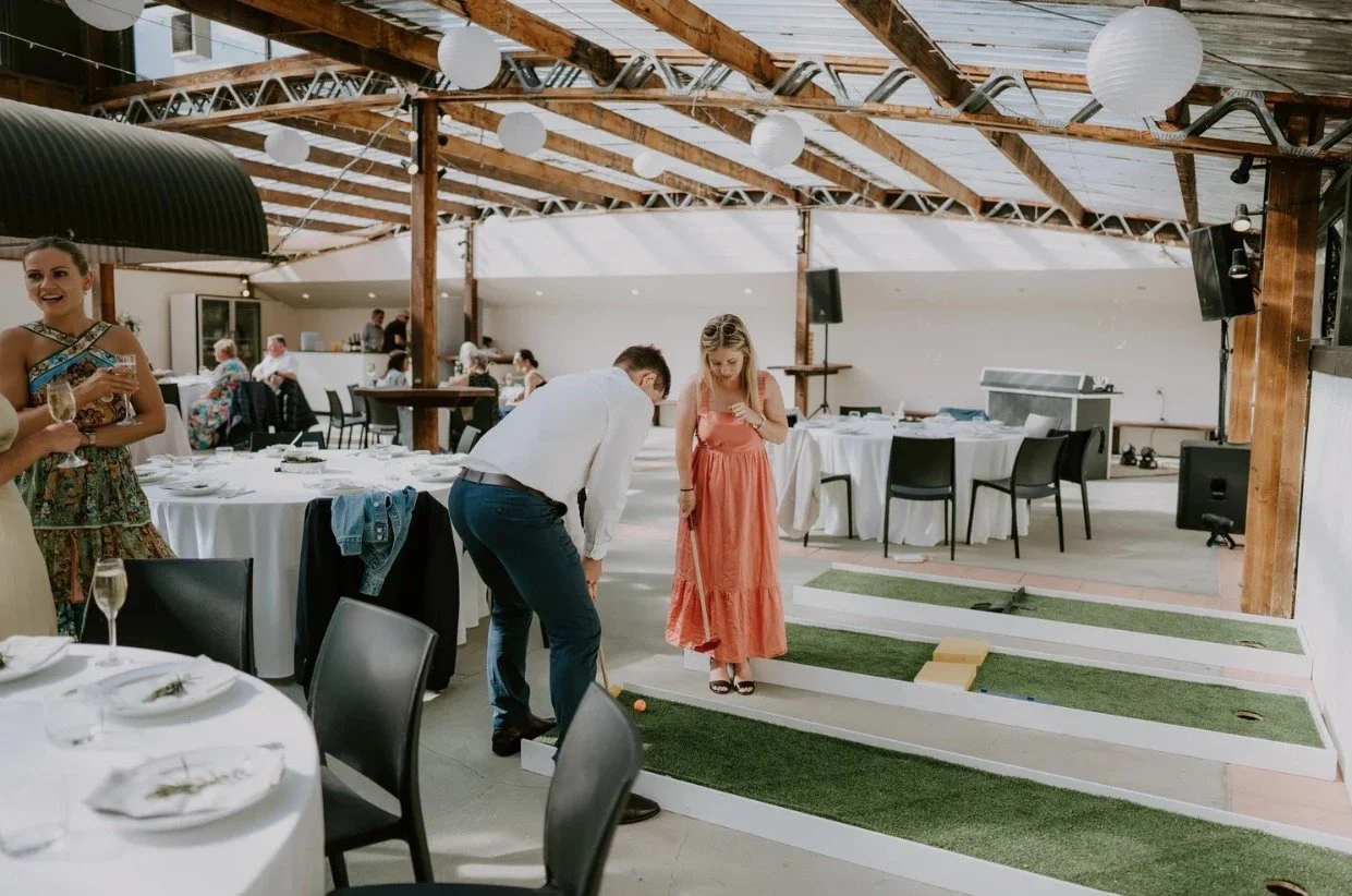 The rain arrived, but cocktail hour carried on exactly as planned.

We quickly moved the lawn games inside, allowing guests to keep playing, mingling and enjoying the experience the couple had imagined.

This is what having a coordinator looks like, 