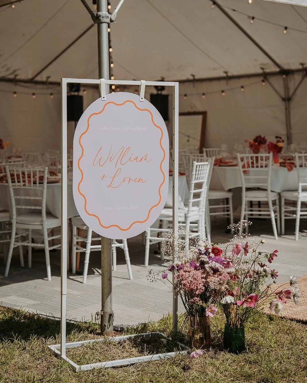 A welcome worth stopping for. 

Playful signage, a pop of orange and flowers at the marquee entrance. We love seeing your personality come through in the details, right from the moment your guests arrive.

https://www.nichollsandco.com/

Planner @nic