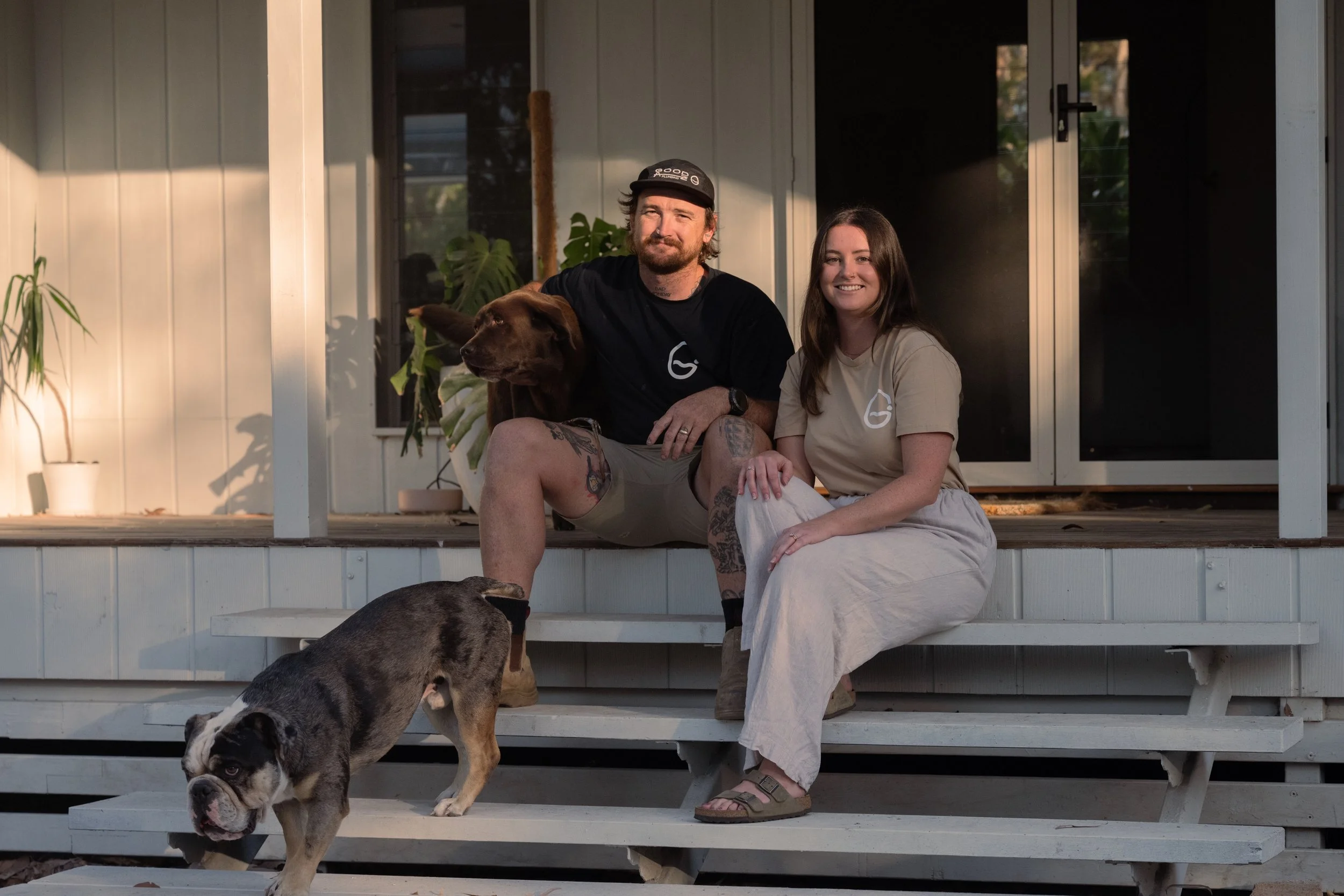 A photo of the owner of Good Az Plumbing with his wife and 2 dogs