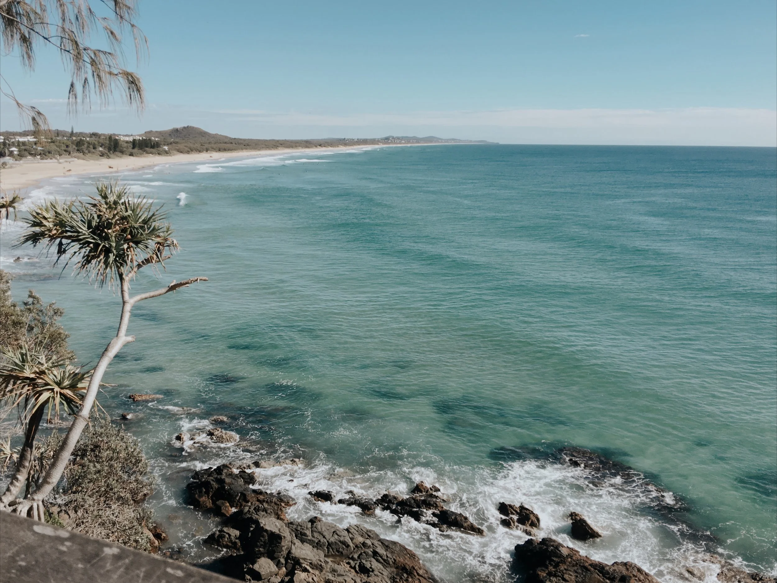 An ocean view from Coolum beach looking towards Noosa