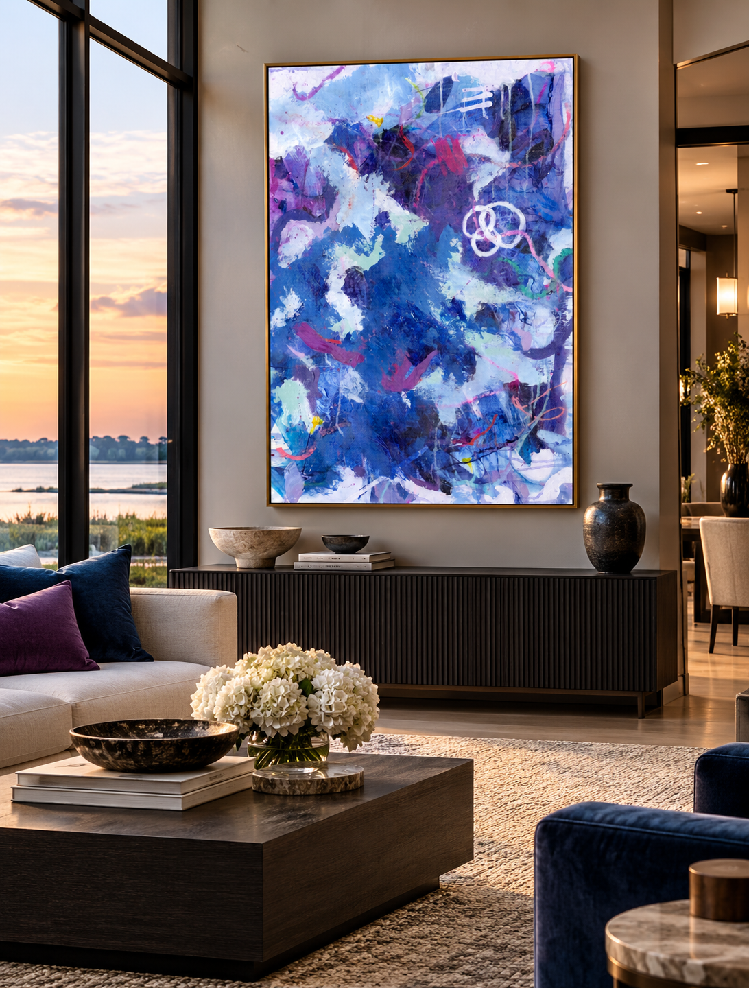 Contemporary living room with dark navy furnishings featuring Tangled Up in Blue II, a colorful blue and violet abstract painting by Karen C. Williams.ChatGPT Image Oct 23, 2026, 01_03_43 PM.png