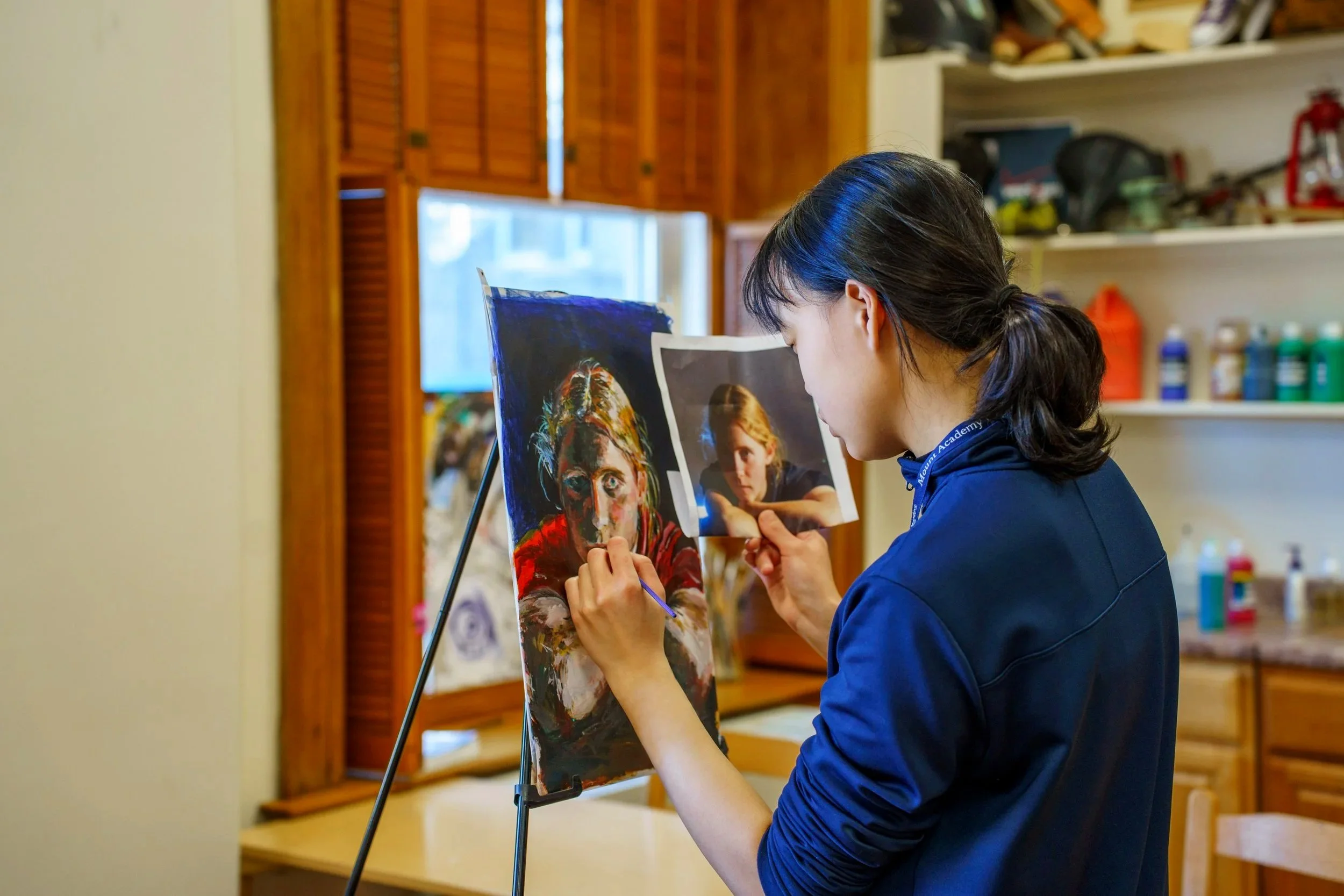 Student painting a picture