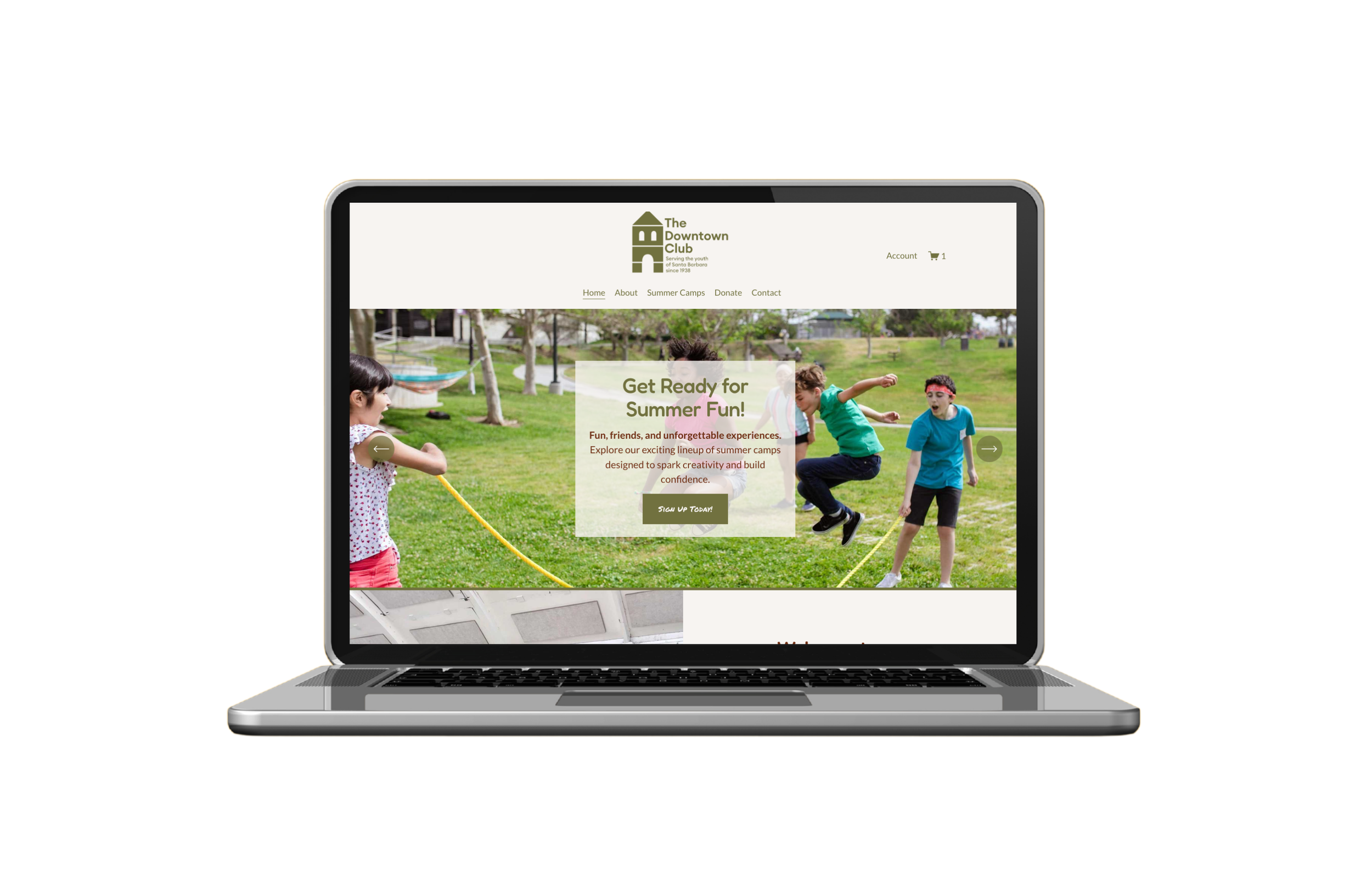 Laptop displaying a website for The Downtown Club, showing children playing on a park grass field with trees in the background.