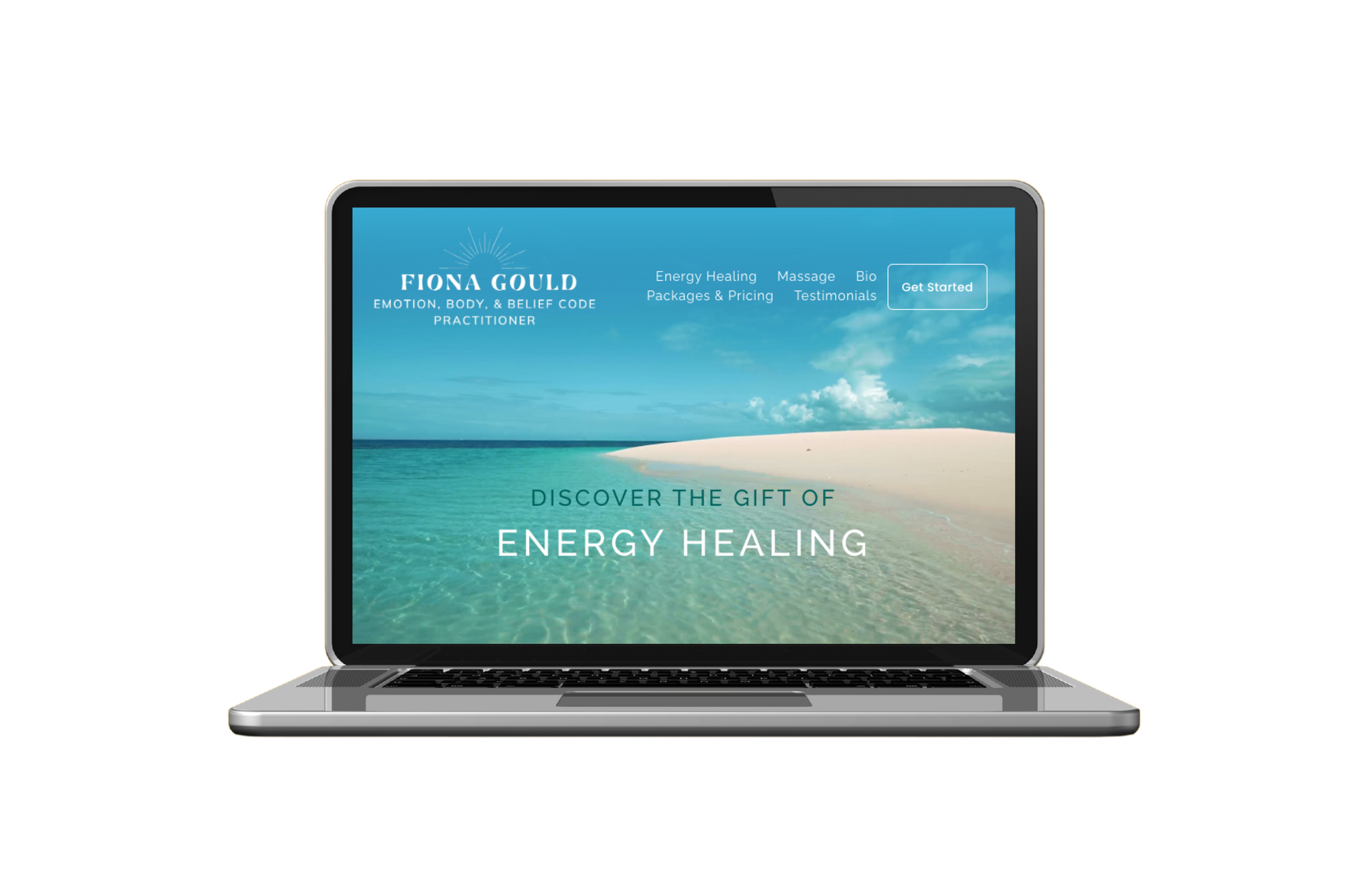 Laptop displaying a website with a blue sky, ocean view, and beach, promoting energy healing services by Fiona Gould.