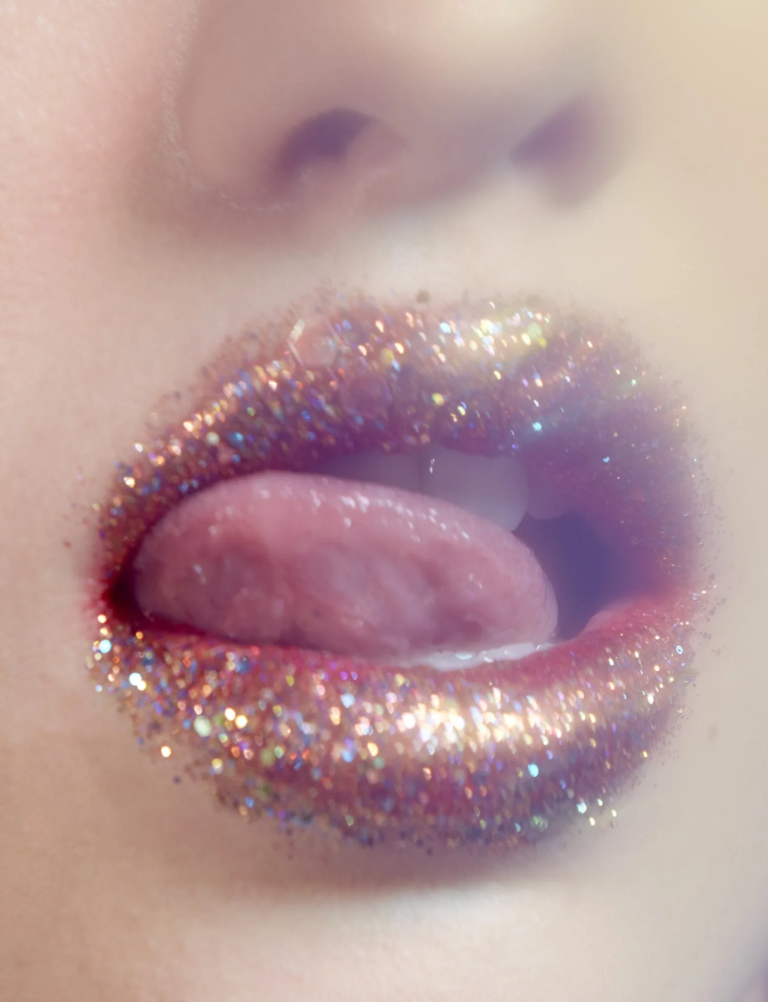 Close-up of lips covered in glitter, with tongue sticking out