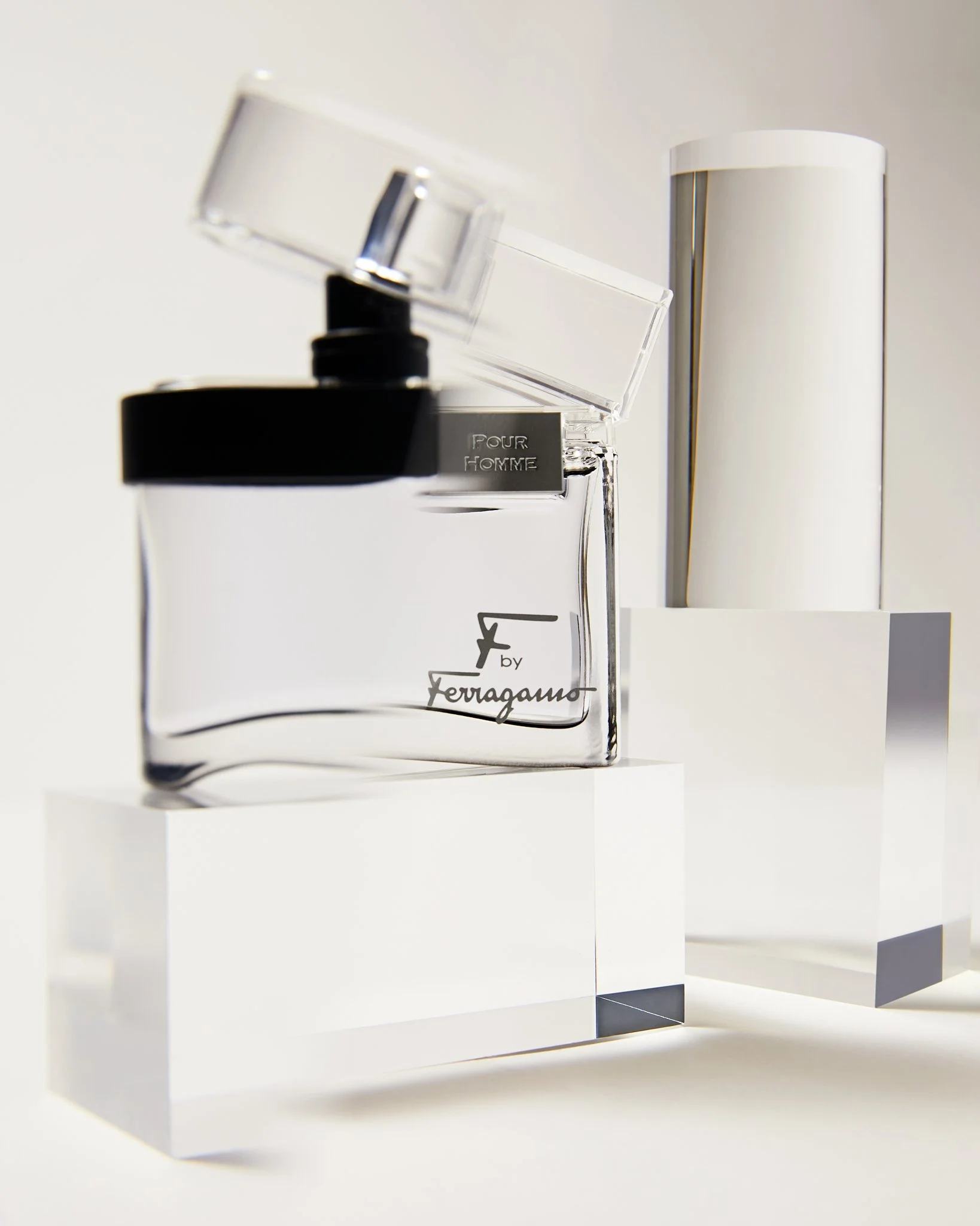 A bottle of Ferragamo perfume on transparent blocks.