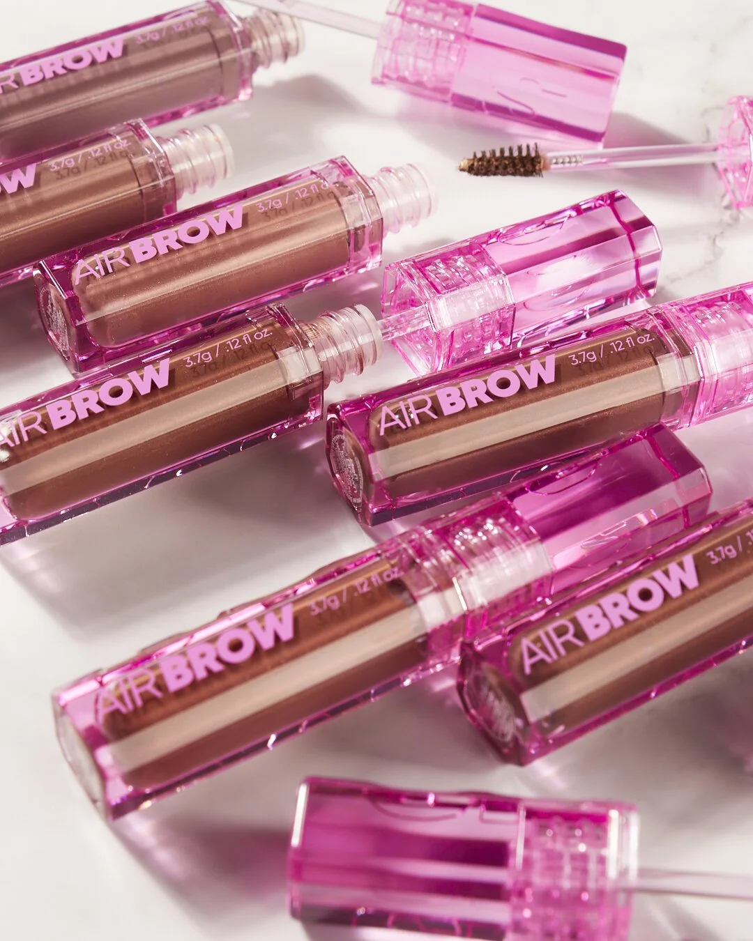 Collection of pink-capped eyebrow gels labeled "Airbrow"