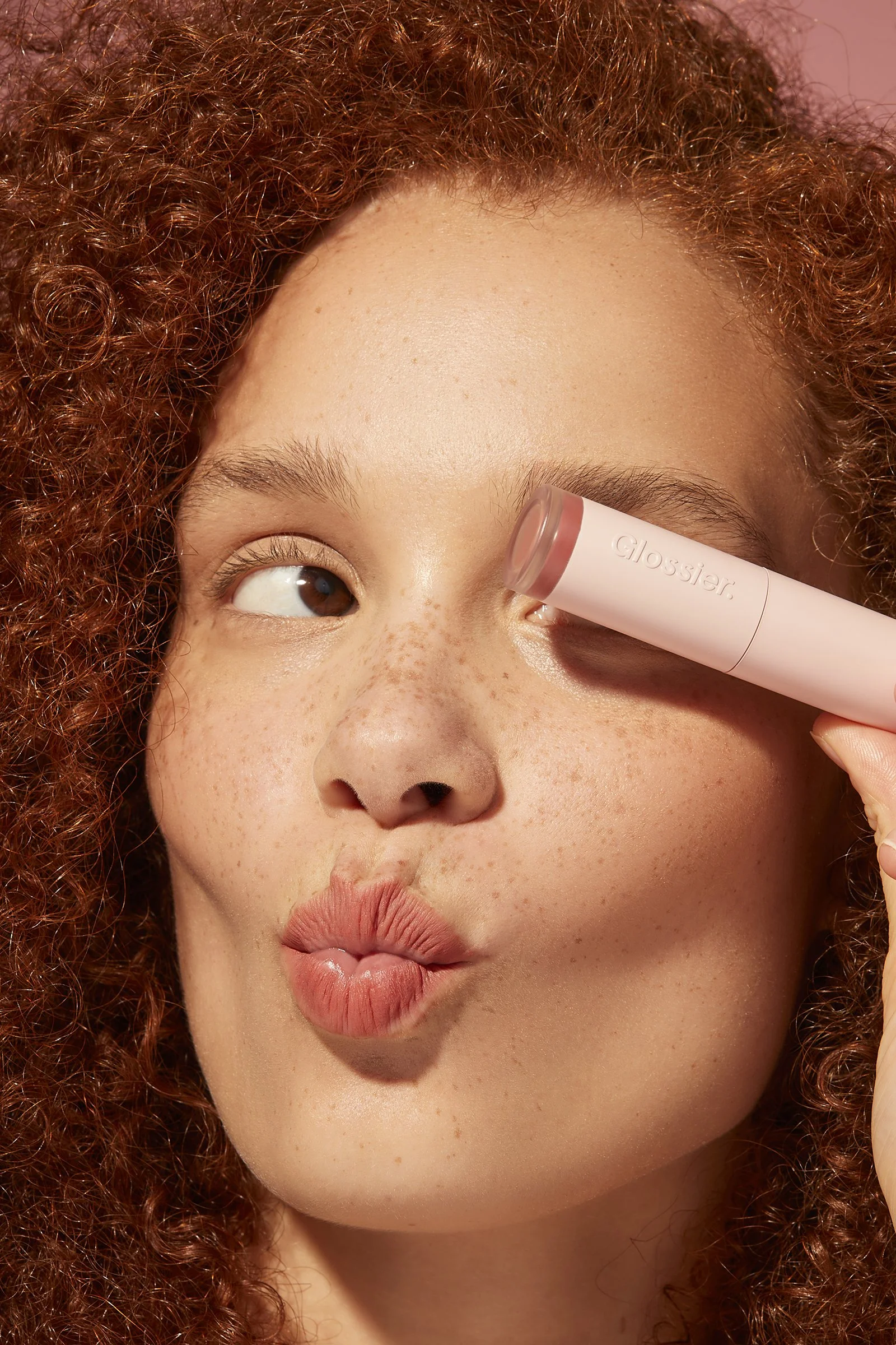 Beauty editorial by Adrianna Favero, NYC-based beauty photographer and director. Featuring fresh, glowing skin, freckles and natural curls using Glossier products—perfect for clean beauty campaigns, skincare branding, and editorial features. Inquire 